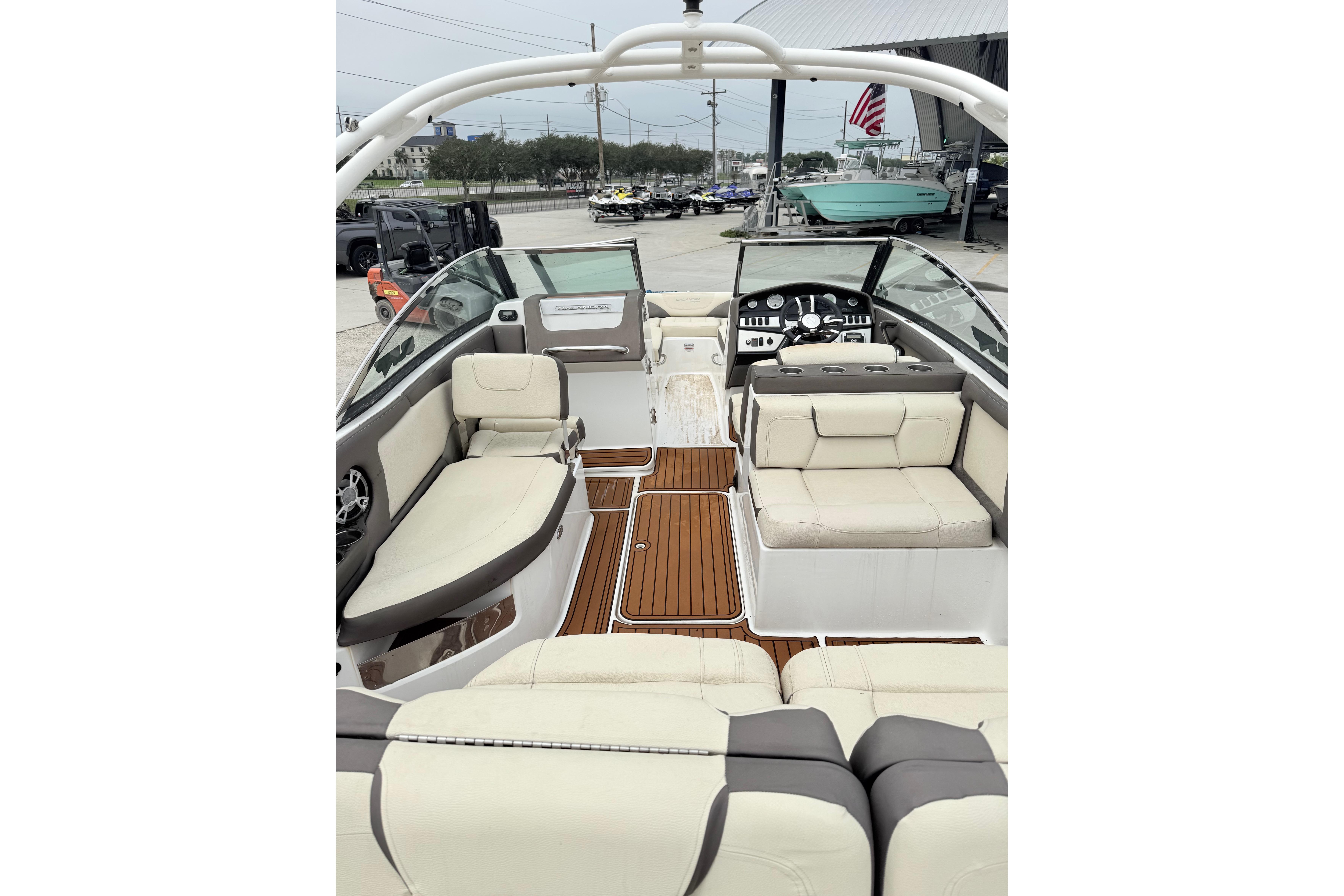 Interior view of a 2018 Bryant Calandra boat with luxurious seating and modern dashboard.