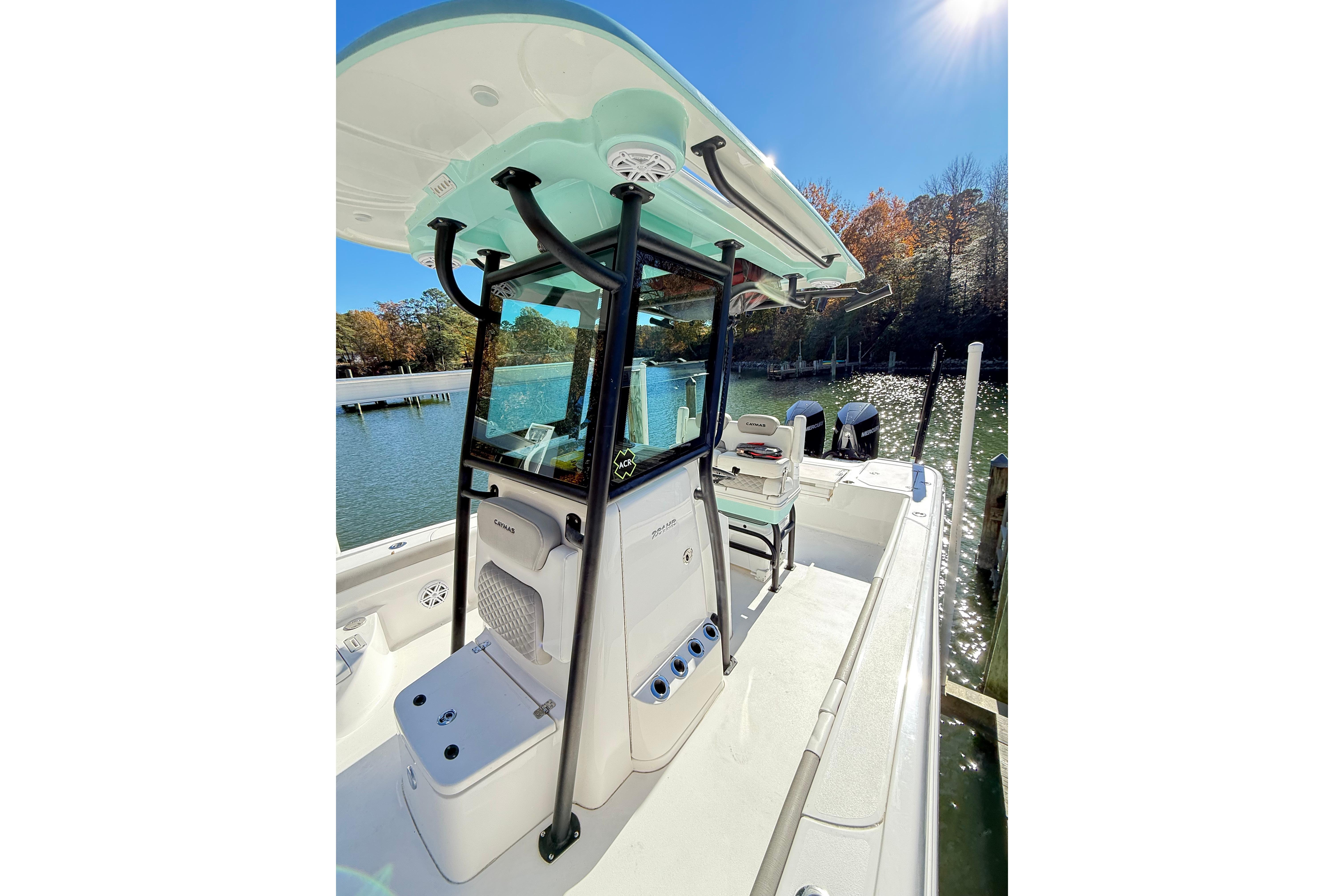 2023 Caymas 281 HB boat docked on a sunny day, showcasing sleek design and spacious deck.