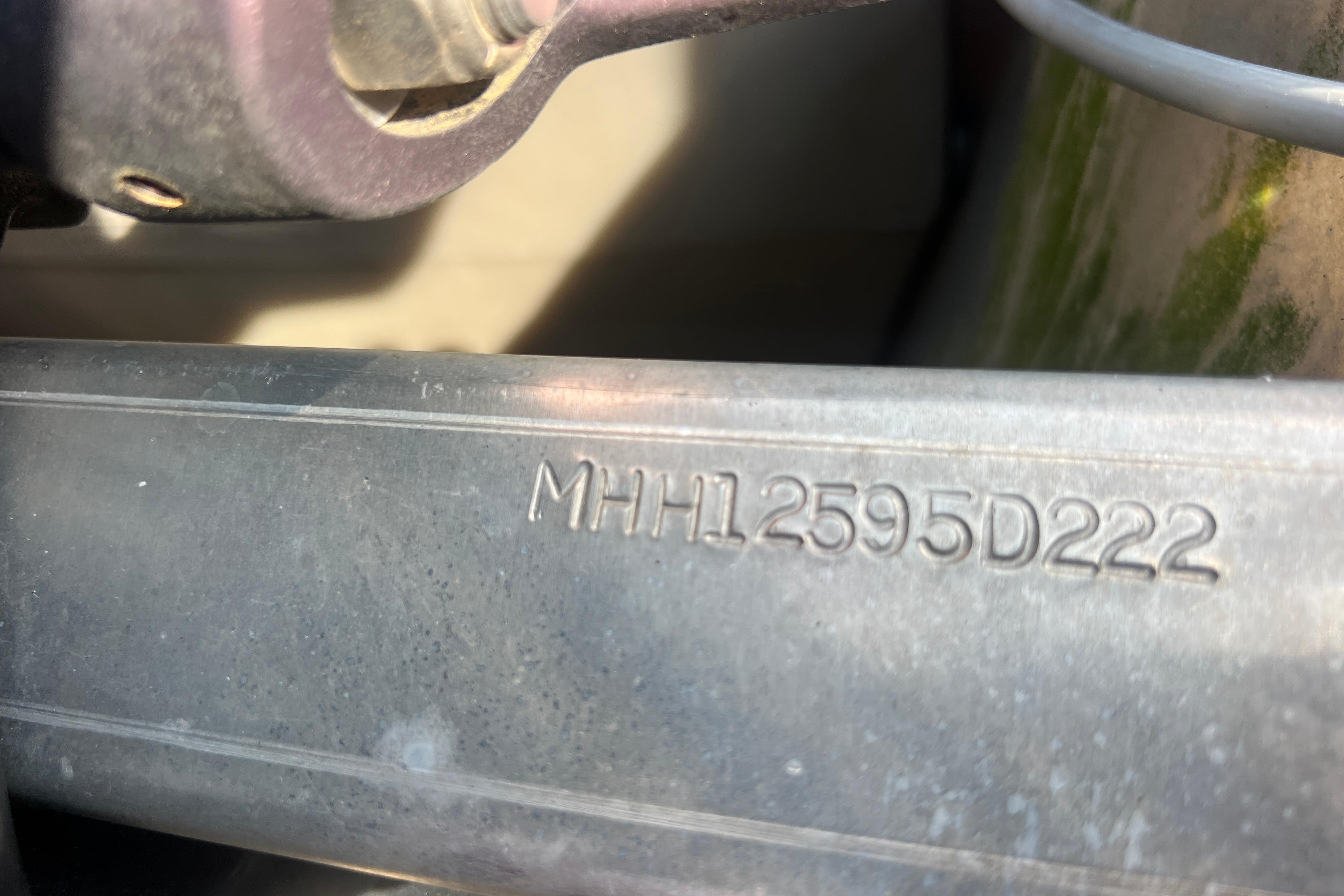 Close-up of Viaggio Lago V-U 22 serial number engraved on metal, 2022 model.