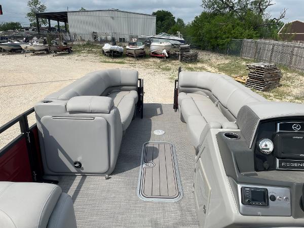 2023 Regency 250DL3 pontoon boat interior with plush seating and modern dashboard.