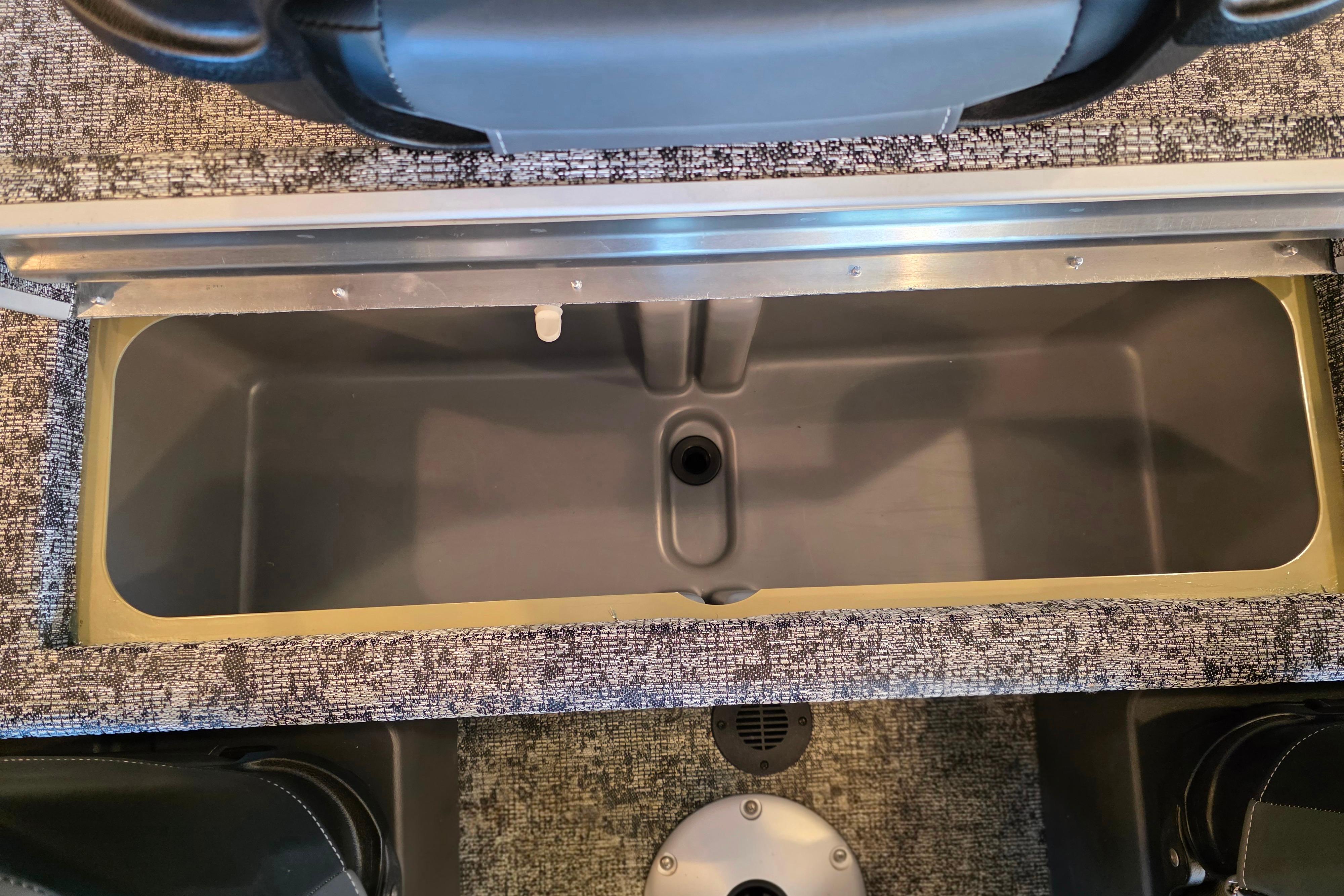Open storage compartment in 2026 Tracker Pro Team 175 Crappie Edition boat.