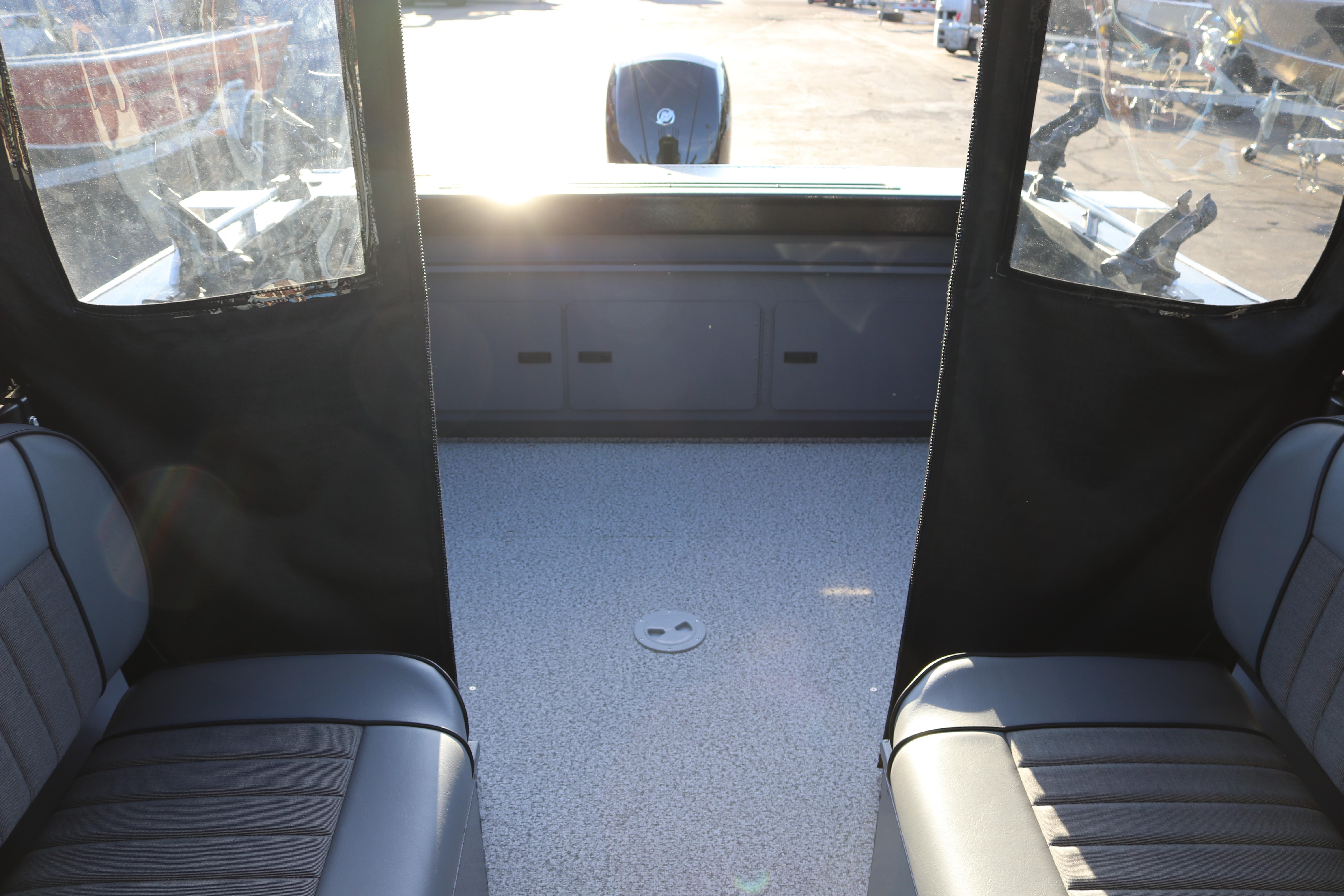 Interior view of 2026 Alumaweld Stryker X202 boat, featuring seating and deck space.