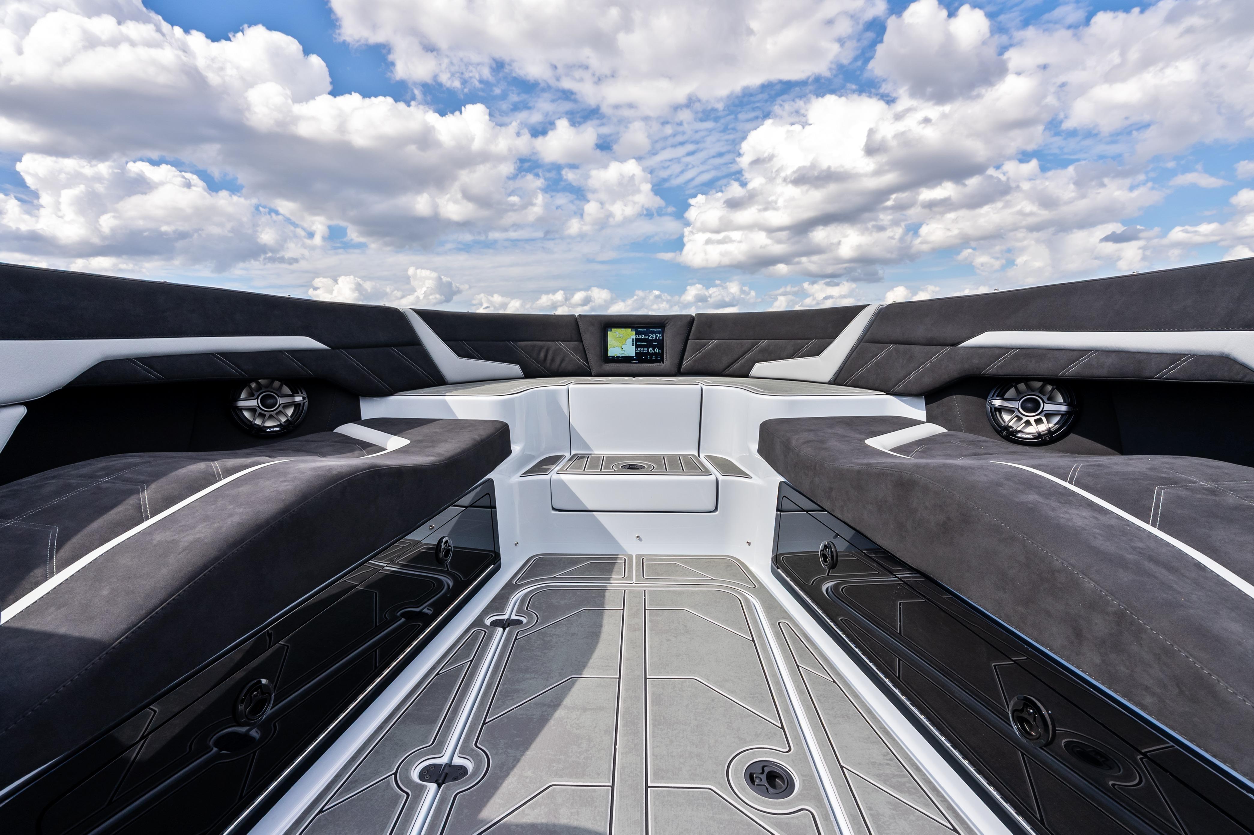 Luxurious interior of 2027 Mystic Powerboats M4200 under a vibrant sky.