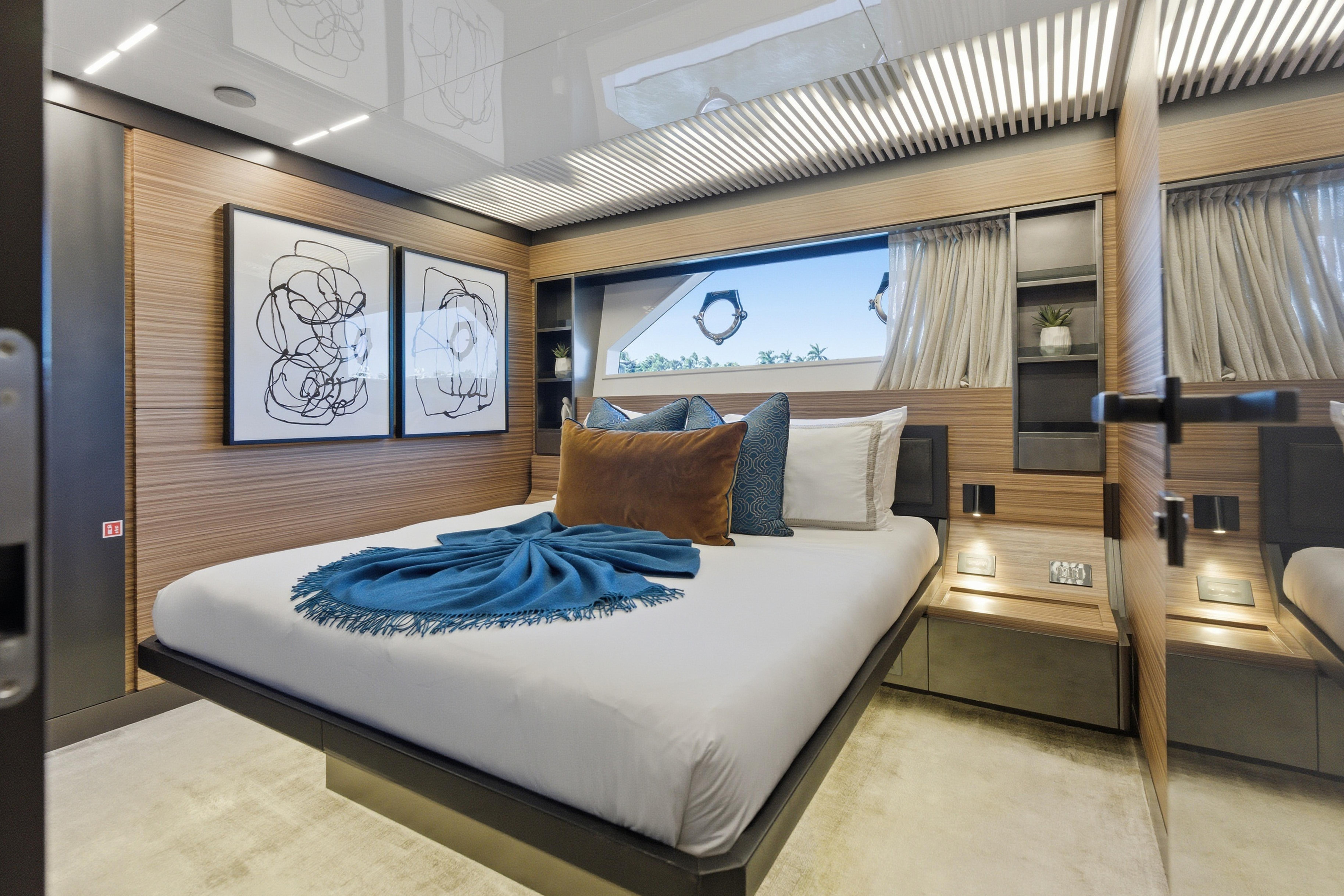 Luxurious bedroom interior of 2018 Ferretti Yachts 920, featuring modern decor and elegant design.