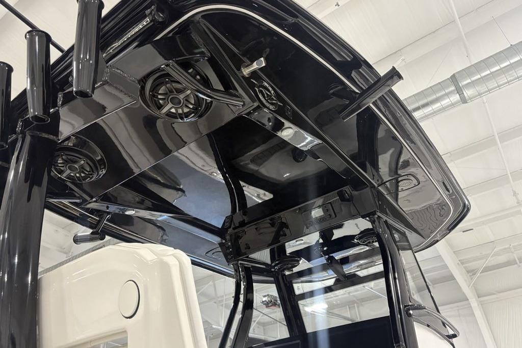 2026 Tidewater 3100 Carolina Bay boat's sleek black T-top with integrated speakers.