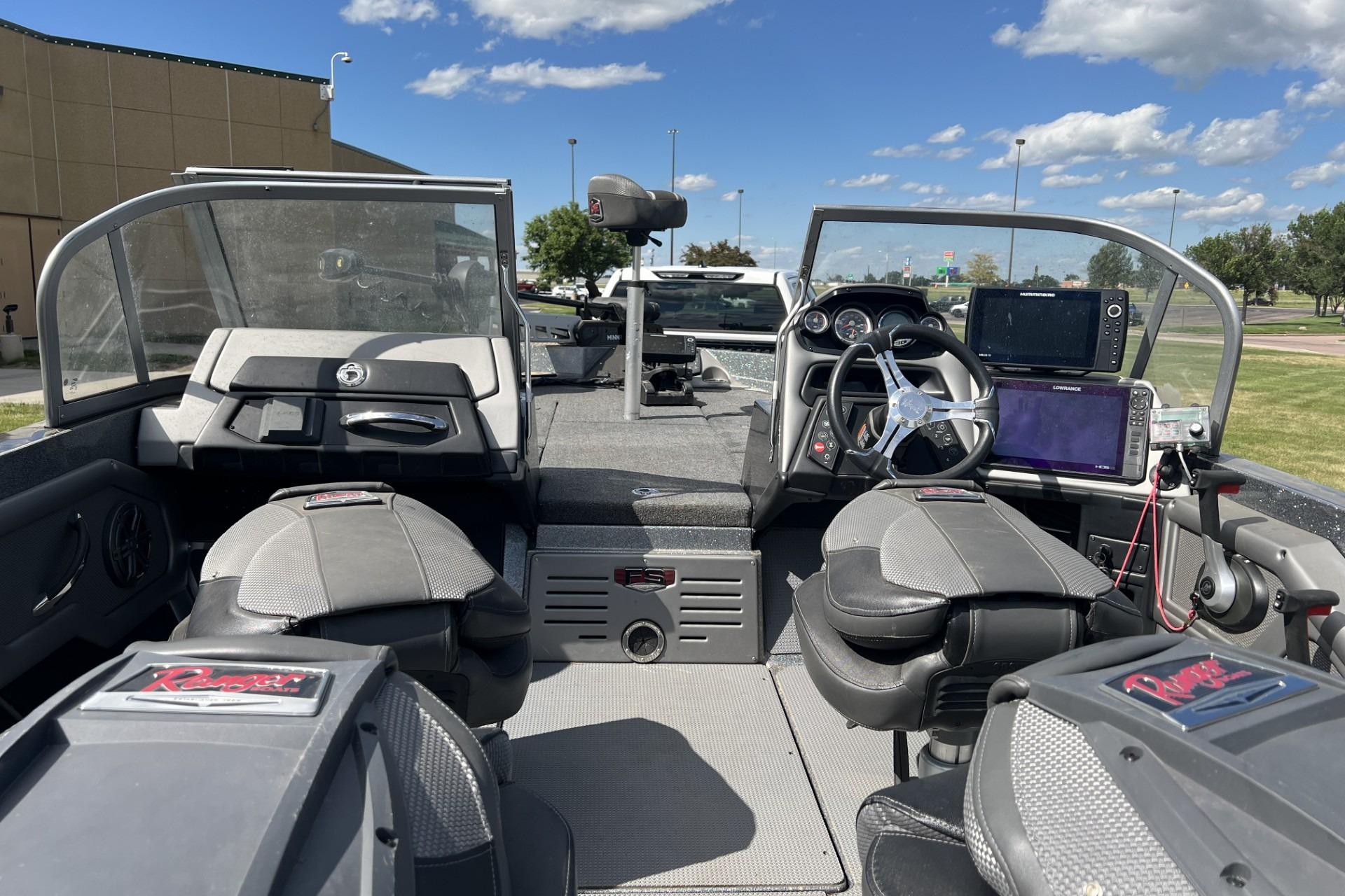 2023 Ranger 620FS Cup-Equipped boat interior with steering wheel and navigation equipment.