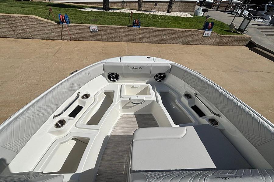 2027 Sea Ray SDX 230 Outboard boat interior with seating and cup holders.