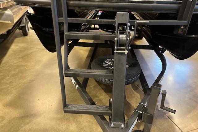 Trailer steps and winch of a 2026 Regency 230 DL boat.
