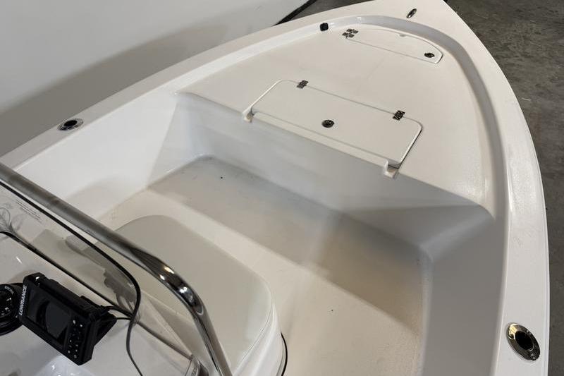 2026 Sea Pro 172 Bay boat interior with storage compartments and control panel.