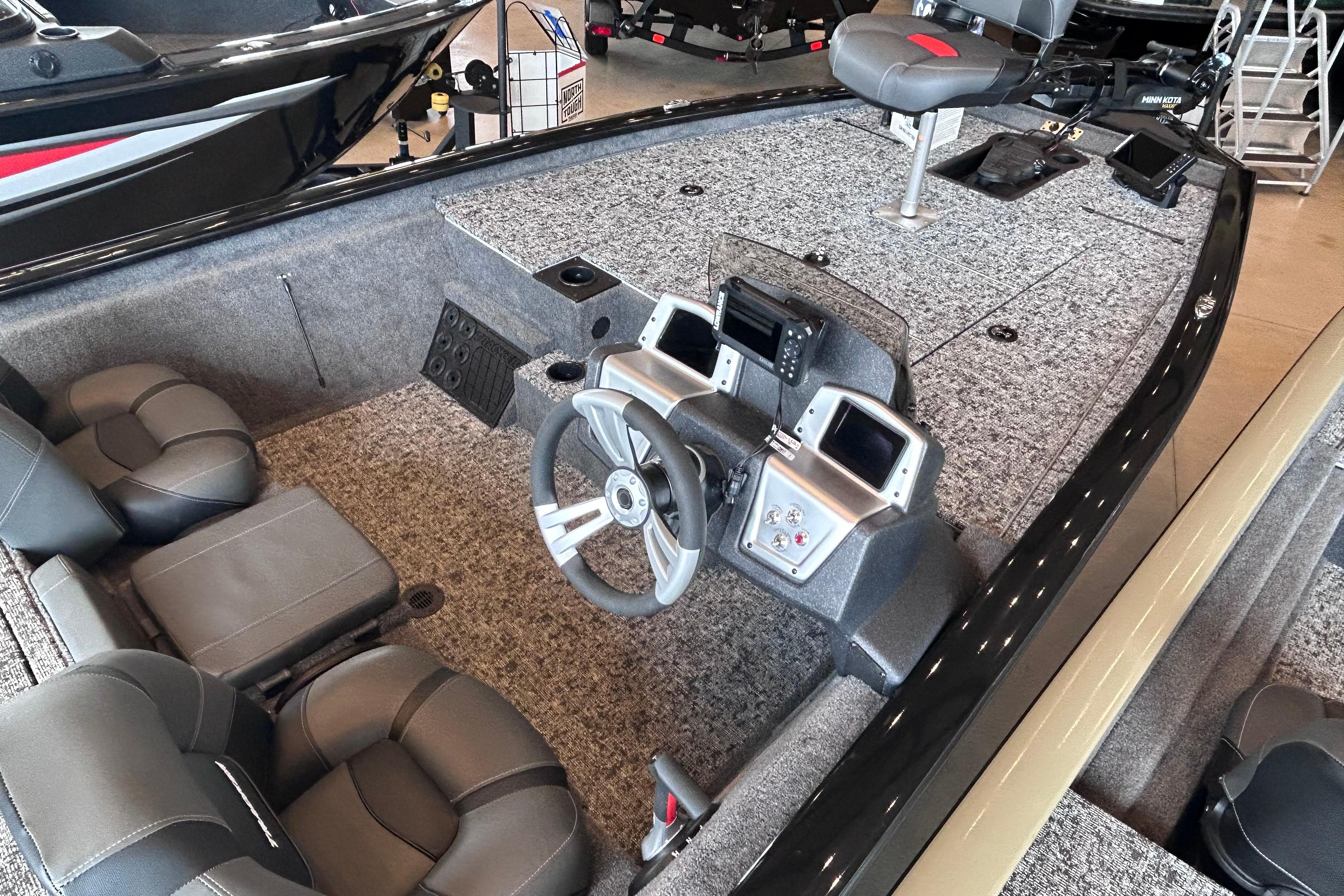 2026 Tracker Pro Team 195 boat interior with steering console and seating.