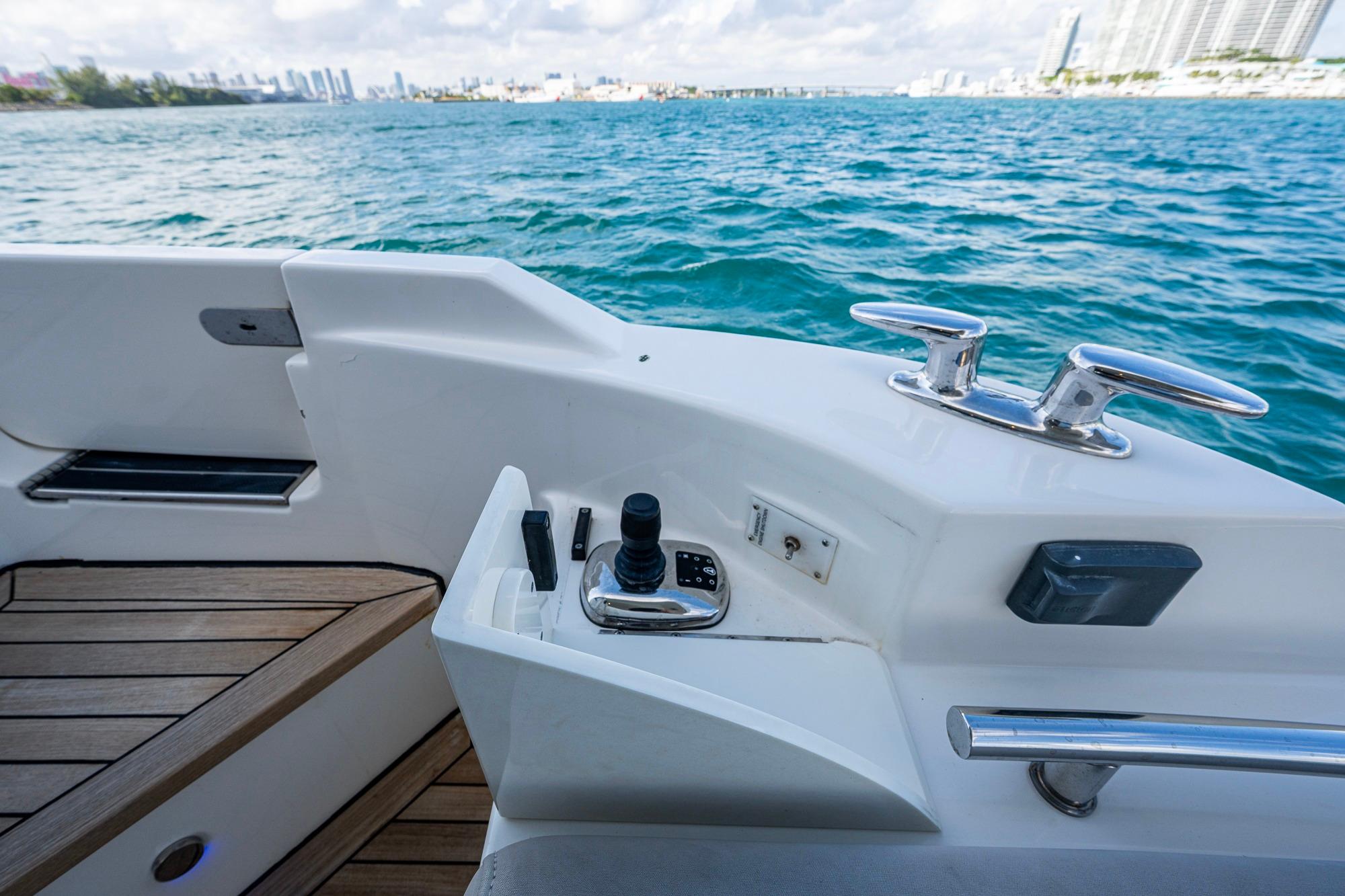 2018 Sea Ray L550 Fly yacht deck with ocean view and control panel.