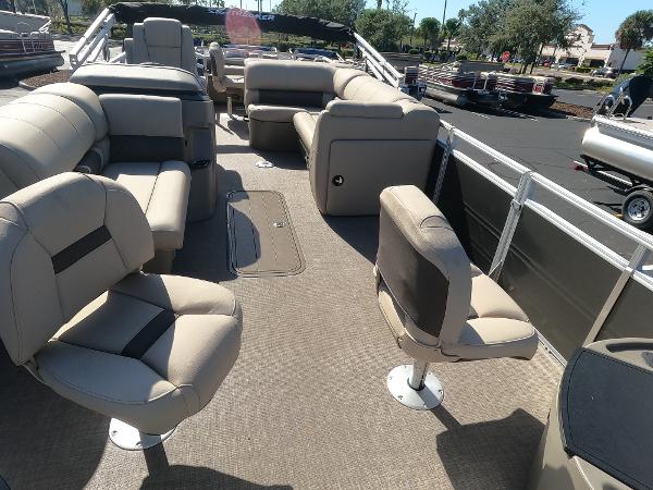 2024 Sun Tracker Fishin' Barge 22 XP3 interior with spacious seating and fishing chairs.