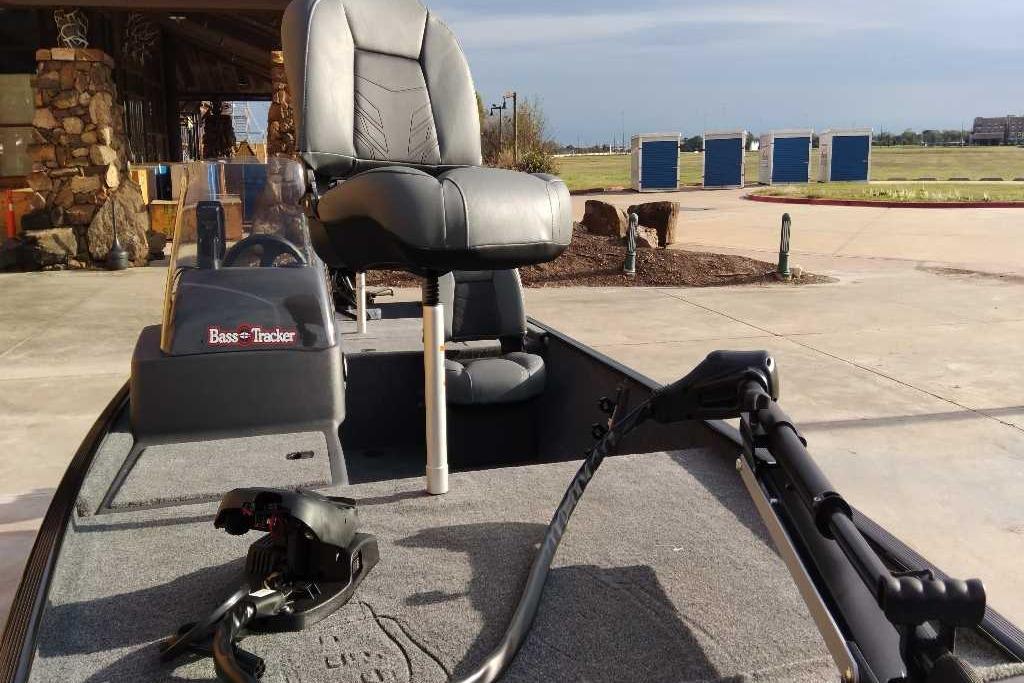 2026 Tracker Bass Tracker Classic XL boat with seating and trolling motor, displayed outdoors.