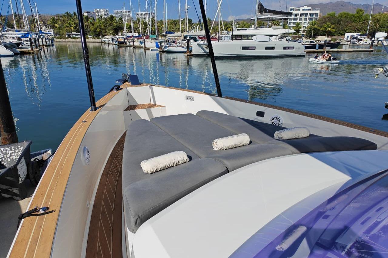 Luxurious 2015 Fjord 40 Open yacht docked in a serene marina setting.