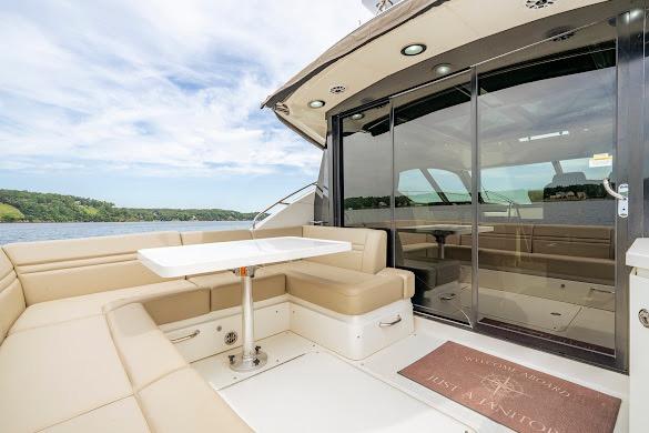 Luxurious 2016 Sea Ray Sundancer 510 yacht with spacious outdoor seating and scenic water view.