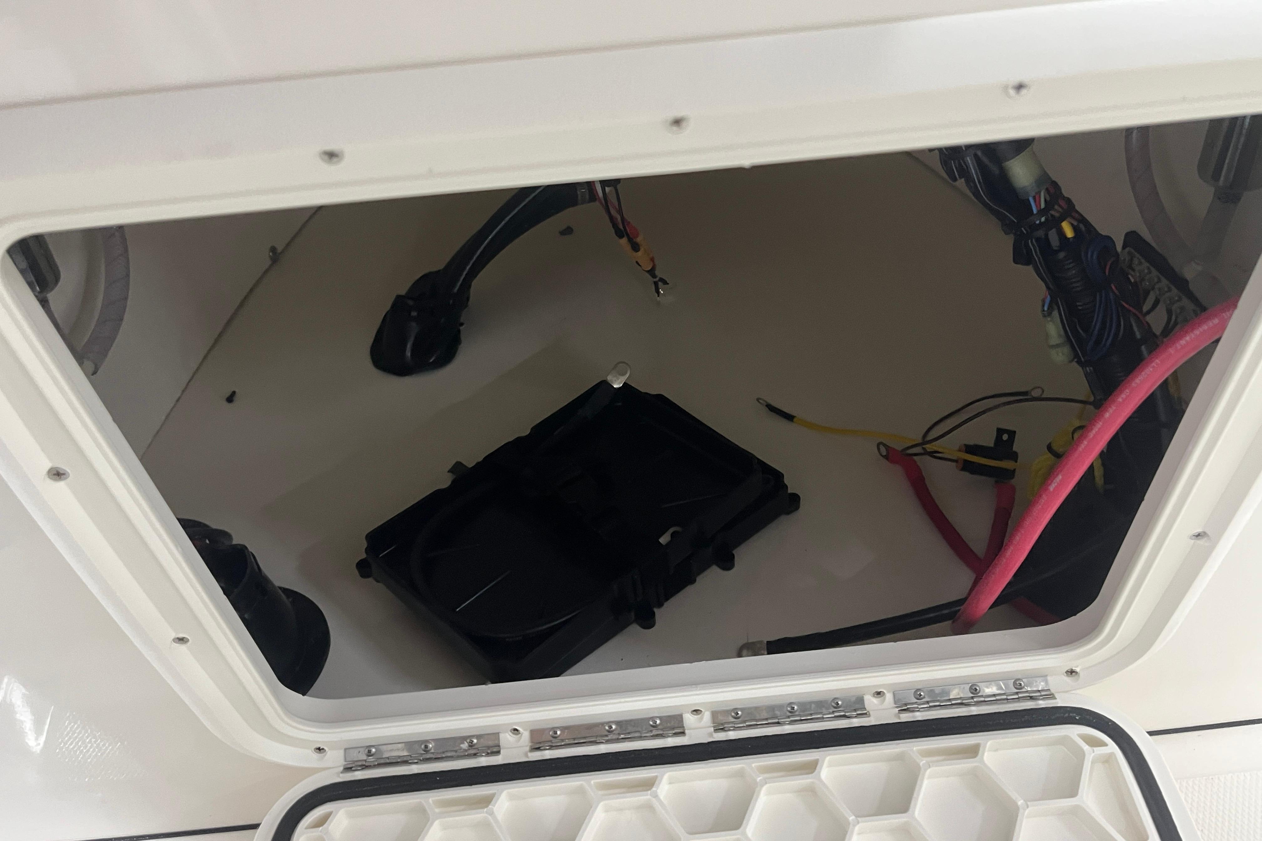 Open compartment of a 2026 Bulls Bay 2000 boat, showing wiring and components.