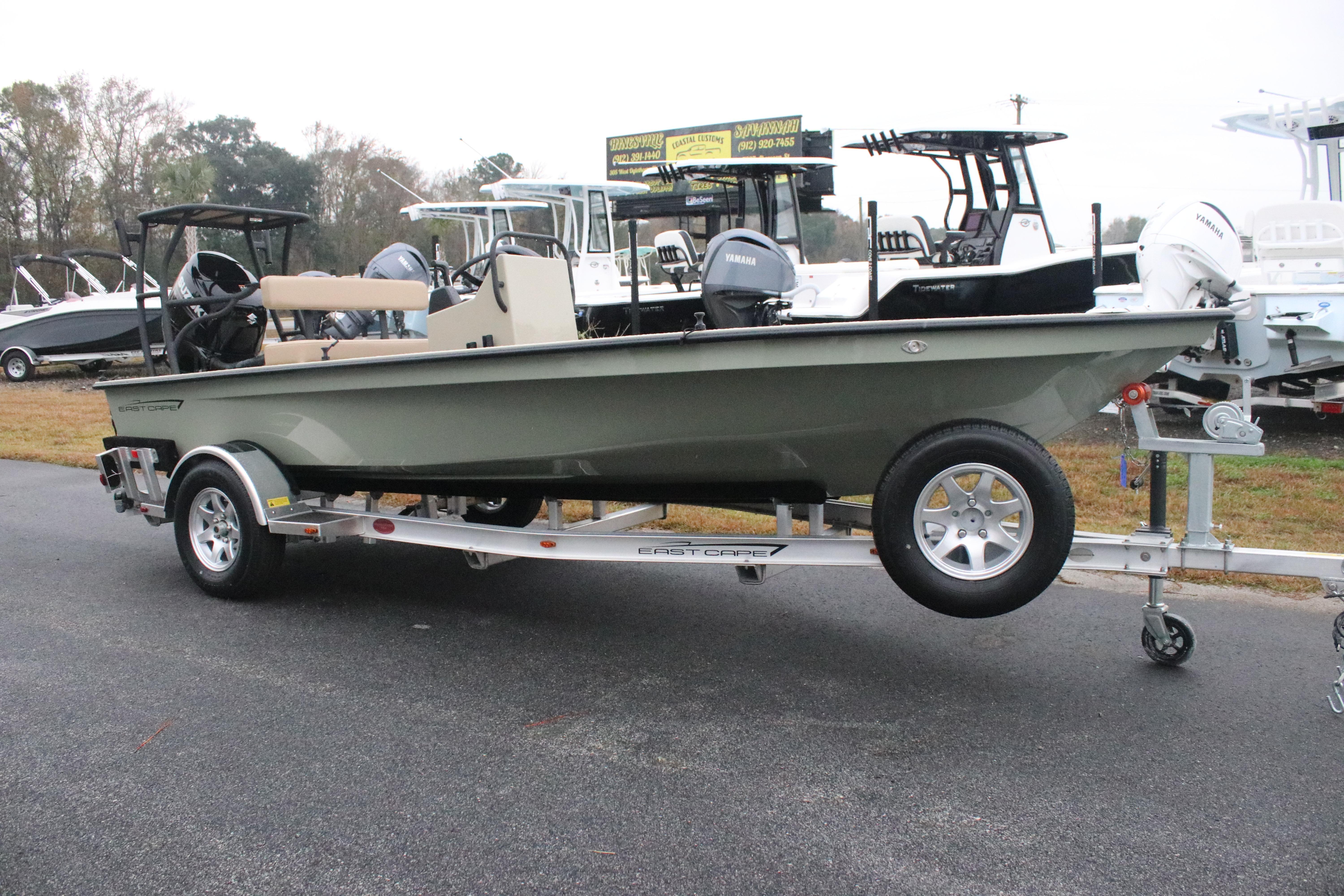 2026 East Cape EVO 18V boat on trailer, displayed outdoors with other boats.