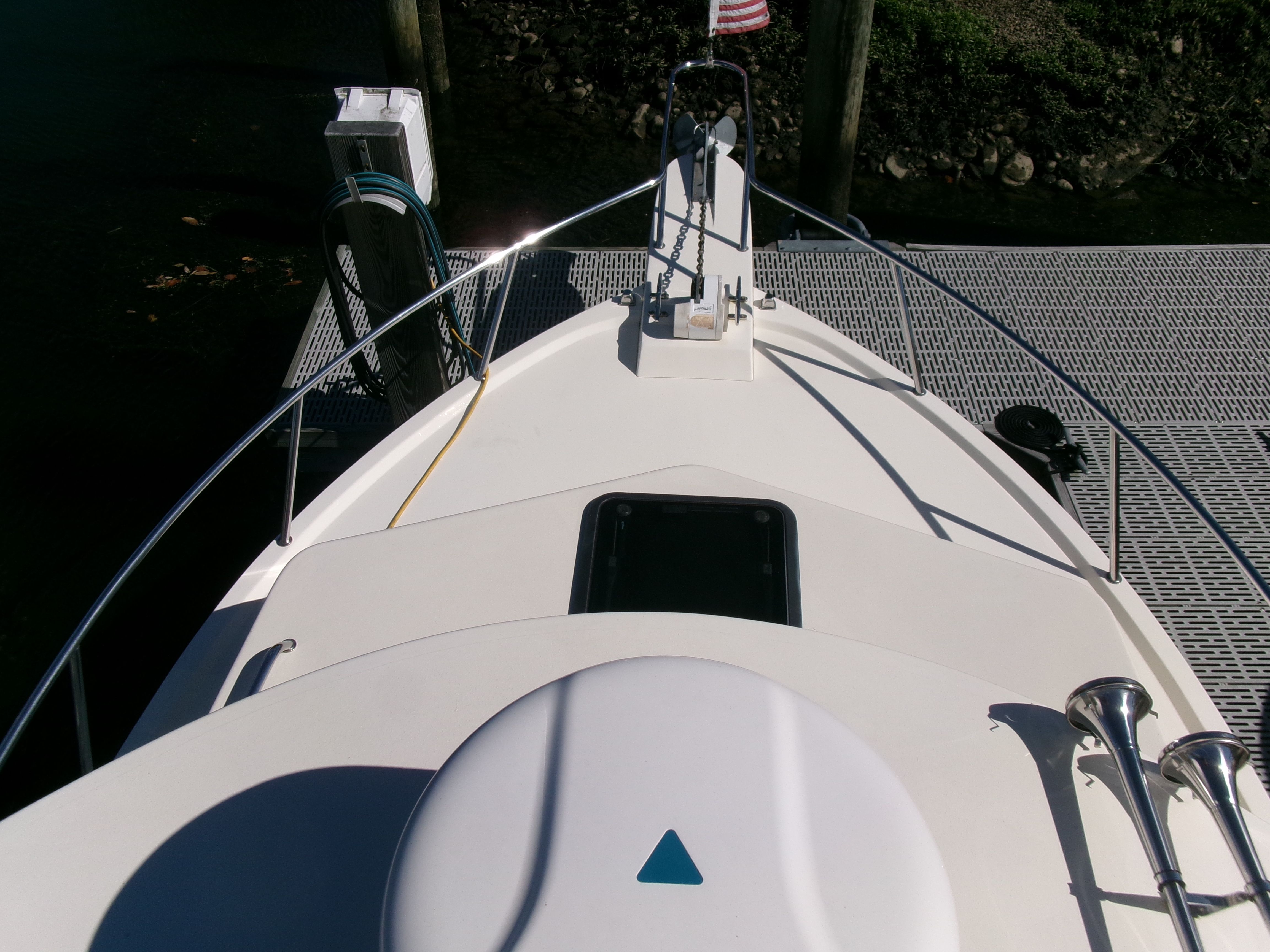 The 2007 Parker 2520 XL Sport Cabin is docked. View of the foredeck.