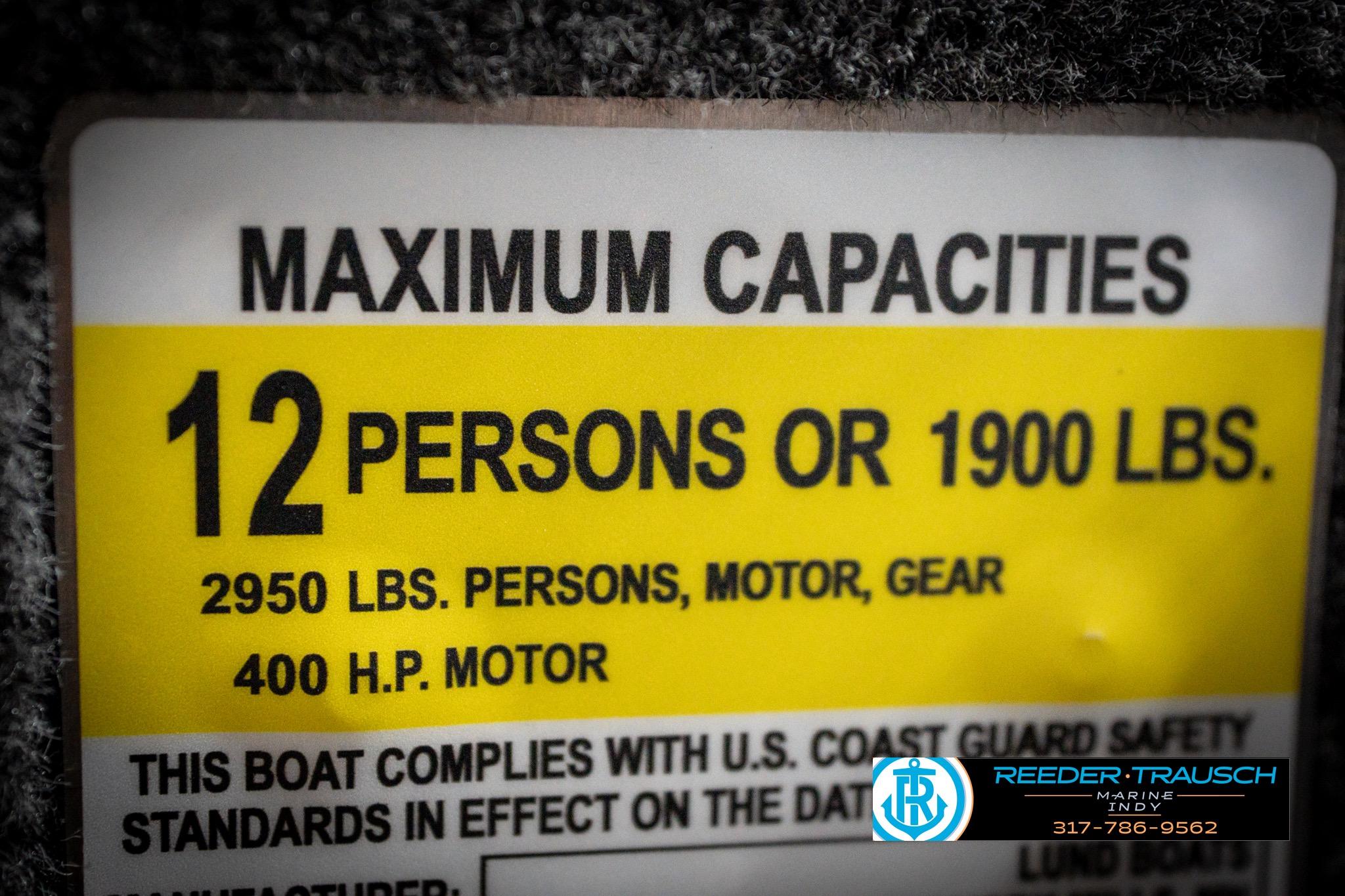 Maximum capacity label for 2026 Lund 2275 Baron boat, 12 persons or 1900 lbs.