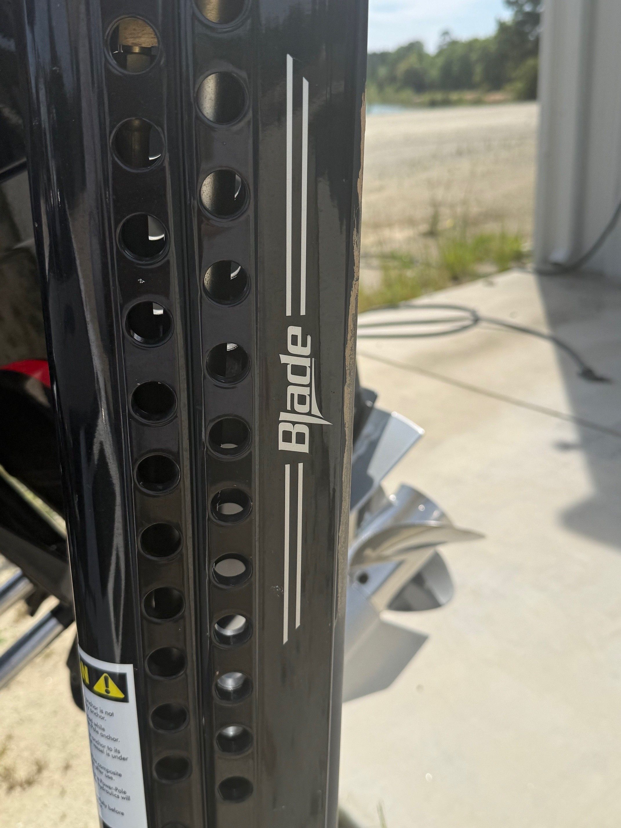 Close-up of a Phoenix 721 ZXL boat part with "Blade" inscription.