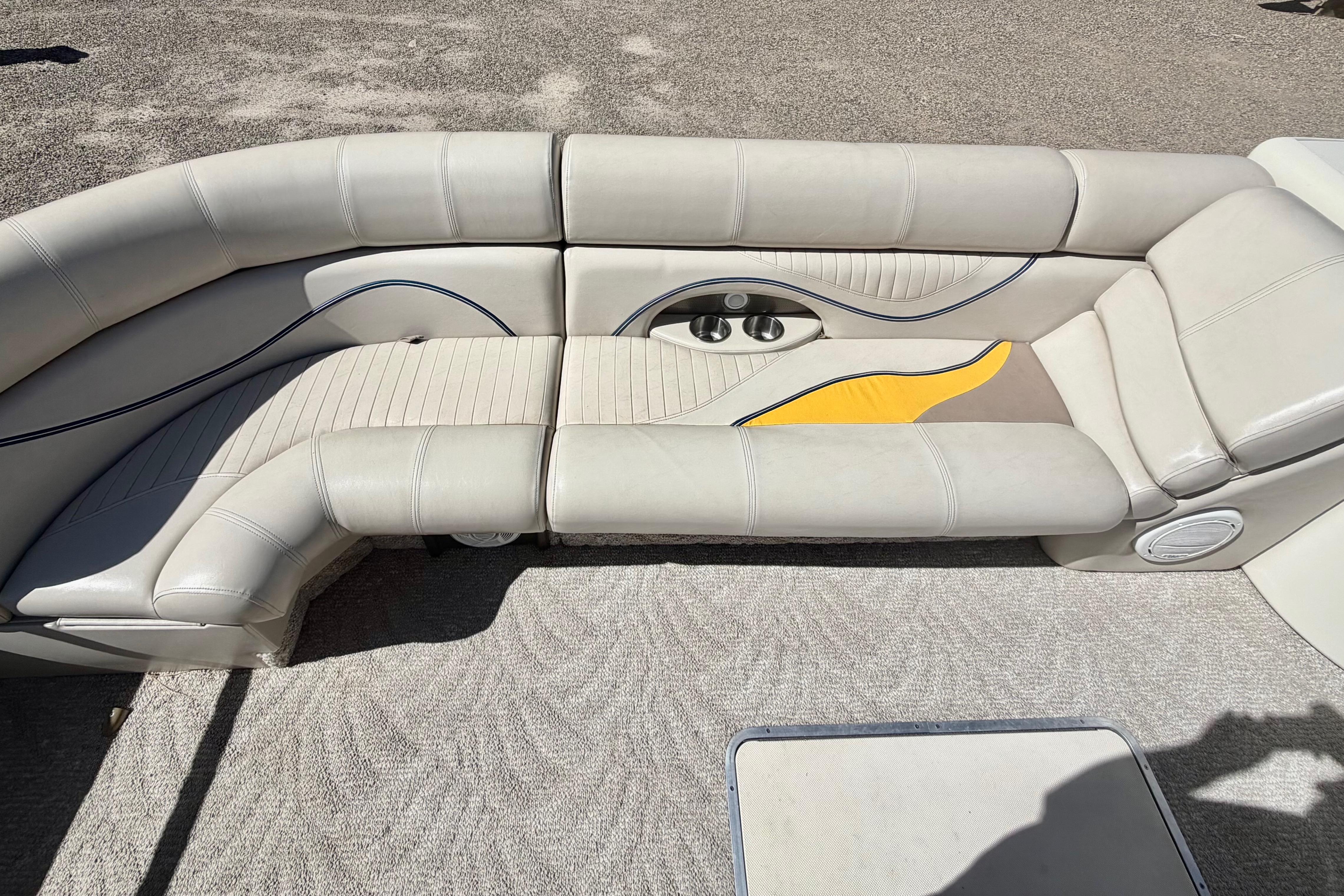 2006 South Bay 925CR boat interior with beige seating and cup holders.