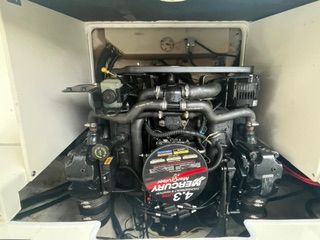 The engine compartment of a 2004 Chaparral 190 SSi features a MerCruiser 4.3 engine.