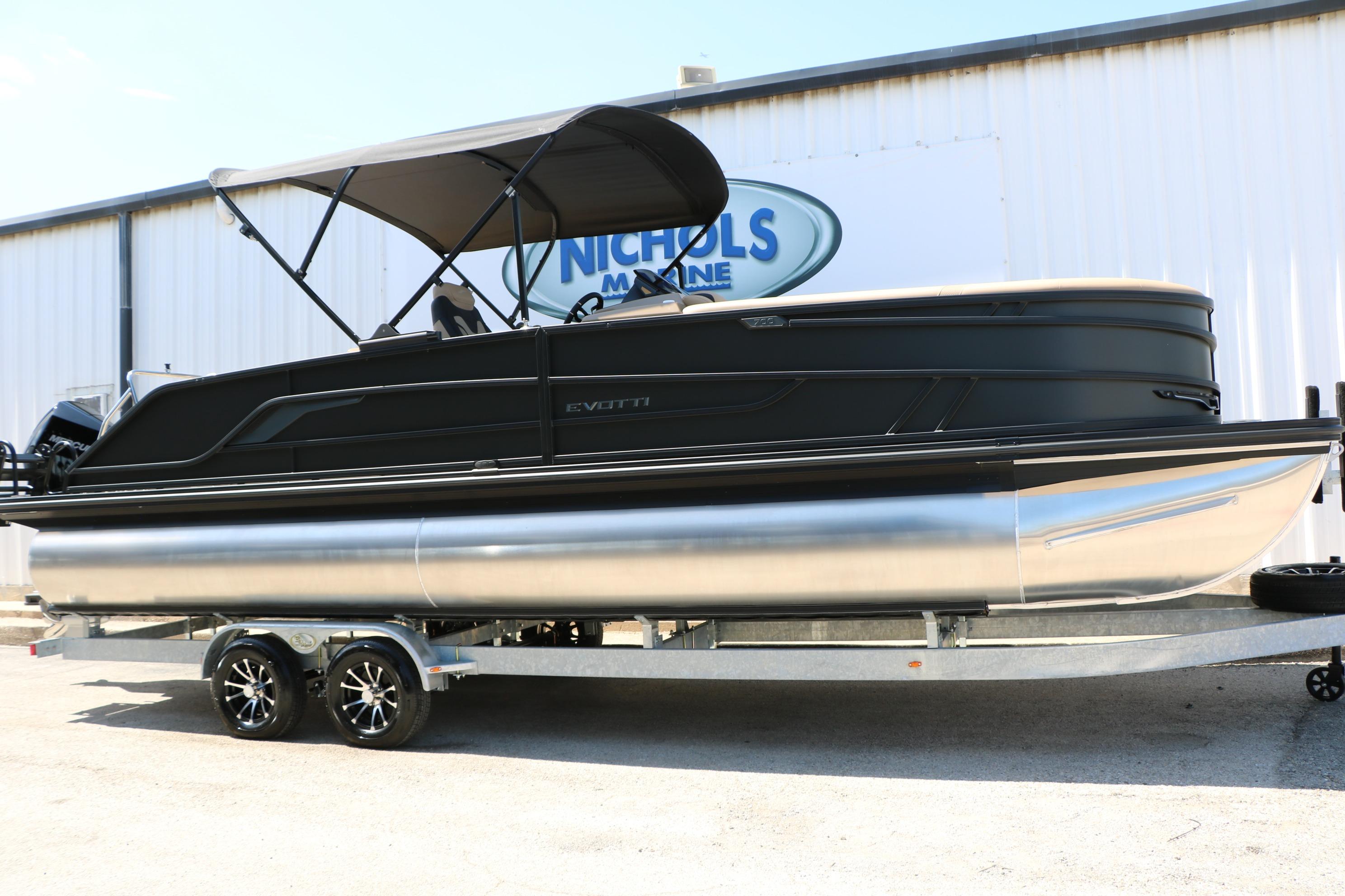 2026 Evotti 725 CS Tri-Toon boat on trailer, displayed at Nichols Marine.