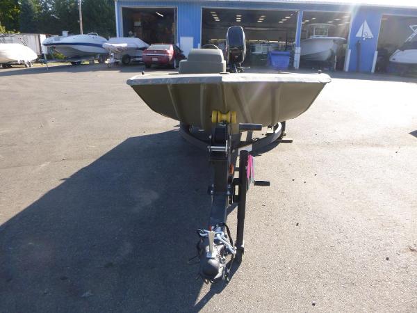 2024 Tracker Grizzly 1648 SC boat on trailer in outdoor dealership lot.