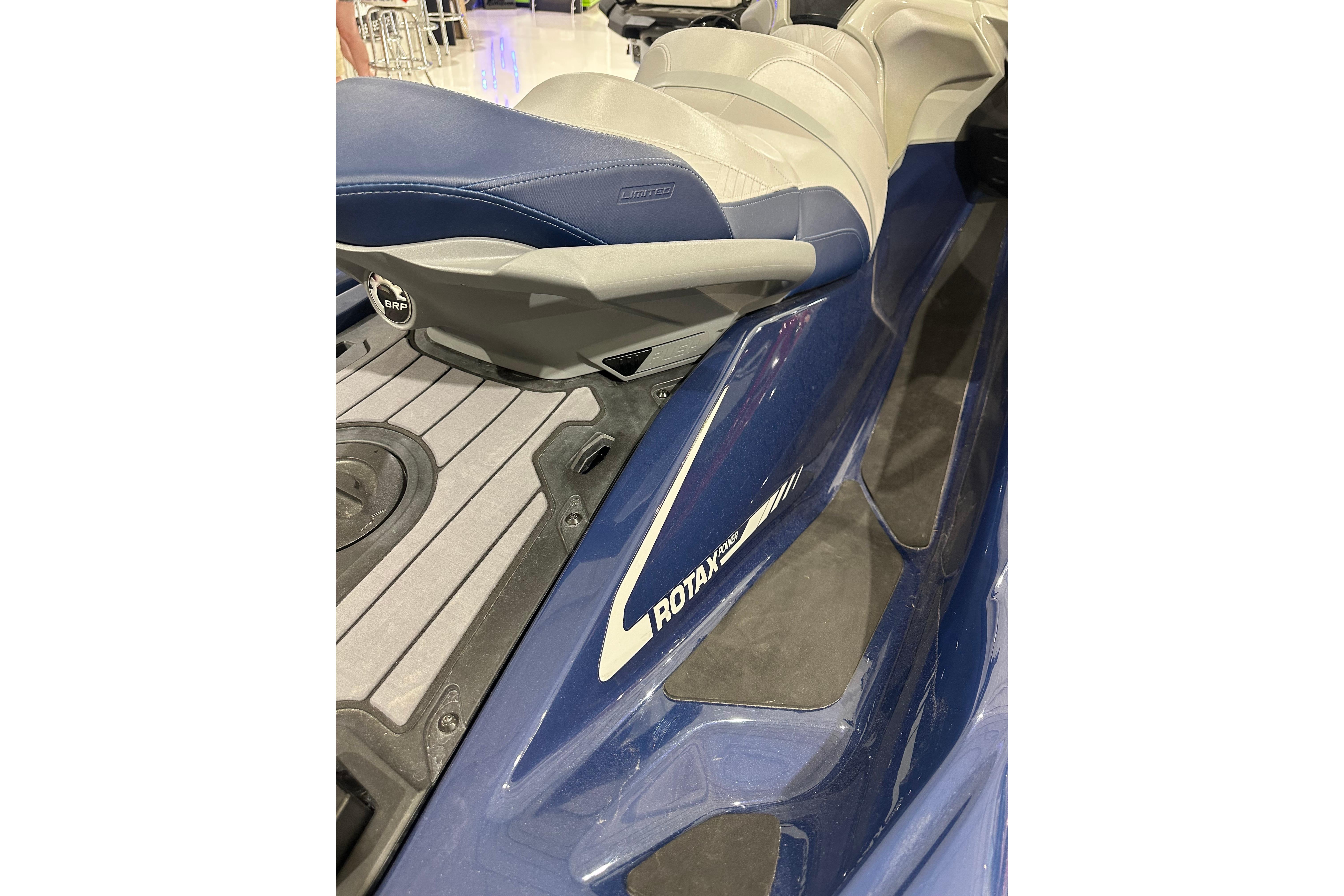 2023 Sea-Doo GTX 230 jet ski, featuring blue and gray seating and Rotax engine branding.