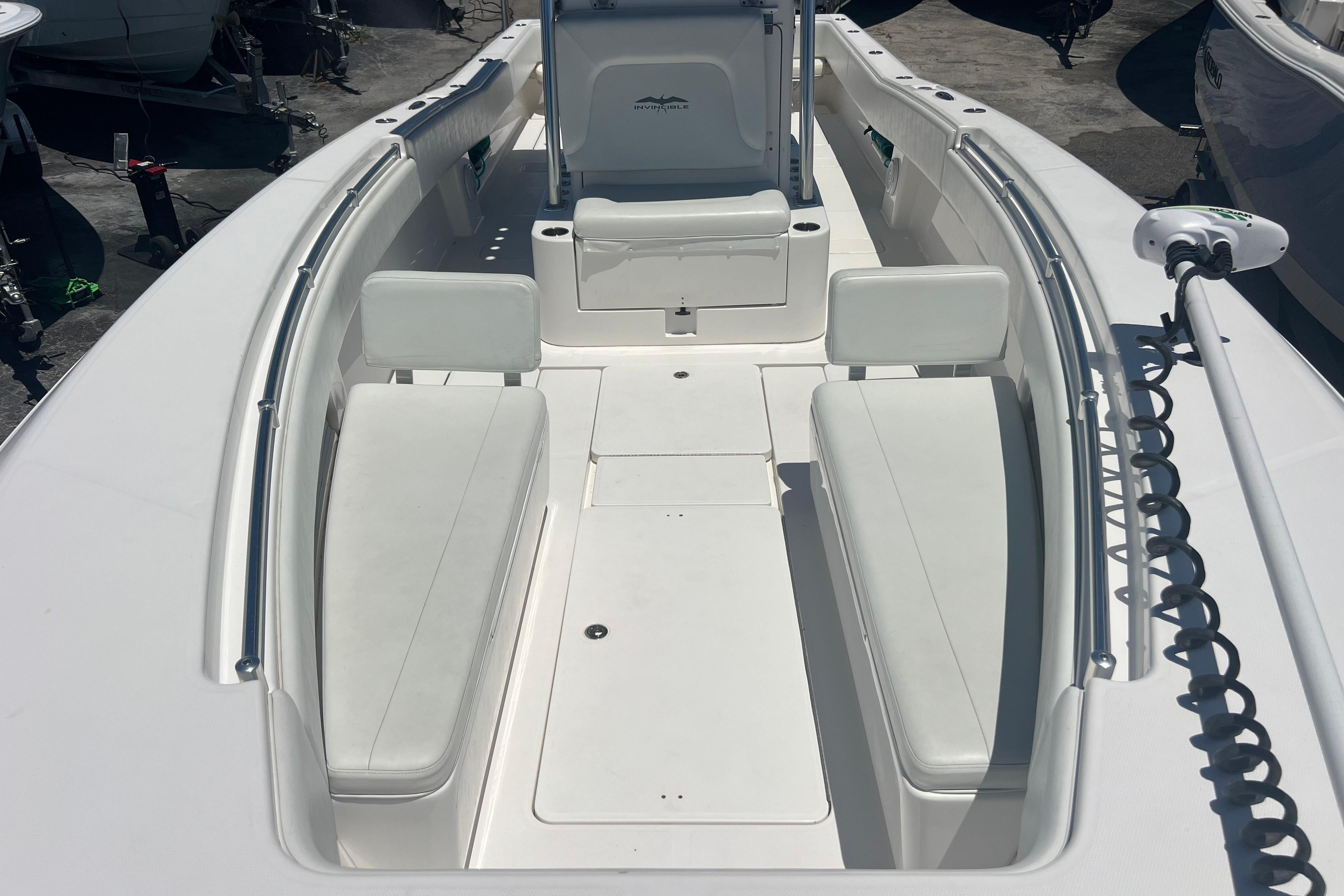 2012 Invincible 33 Open Fisherman boat interior with white seating and spacious deck.