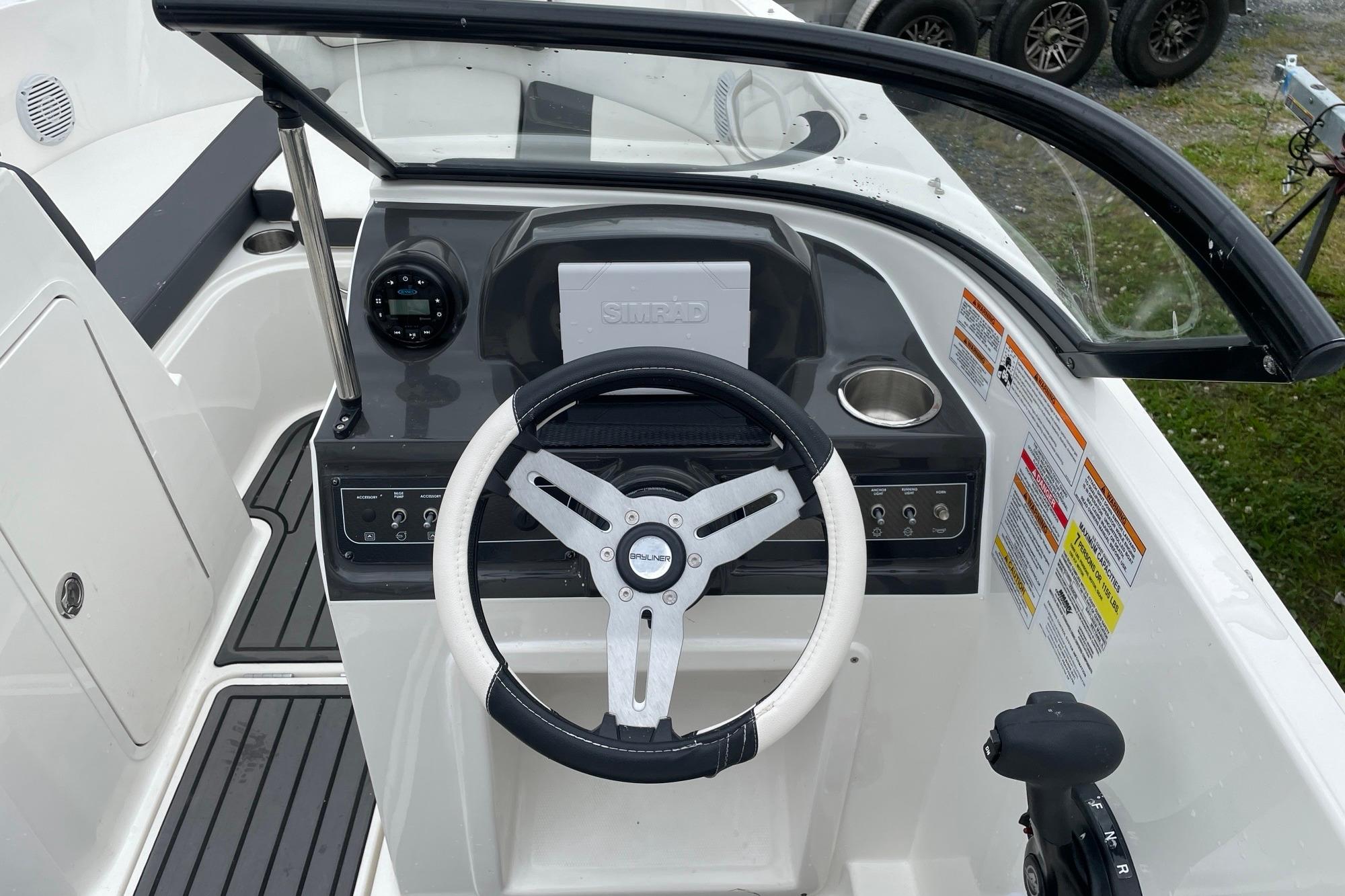 2023 Bayliner VR4 Bowrider OB dashboard with steering wheel and controls.