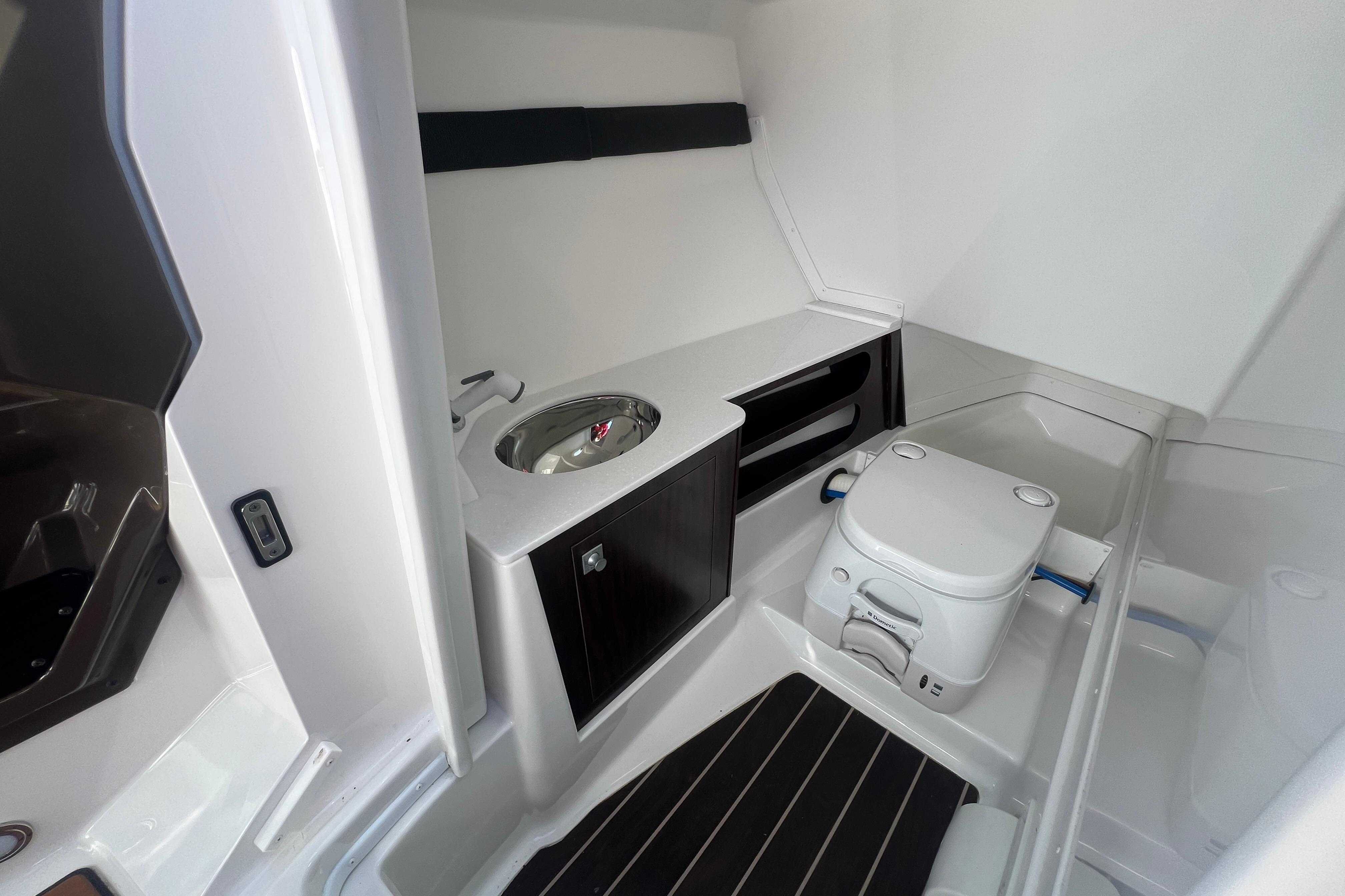 Interior of 2017 Monterey 298SS Super Sport boat with sink and toilet.