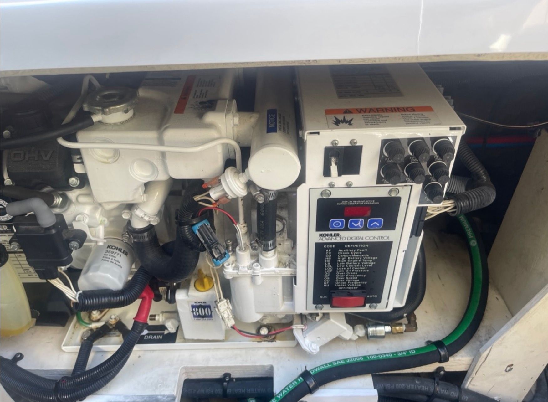 Engine compartment of 2006 Sea Ray 270 Amberjack with Kohler generator.