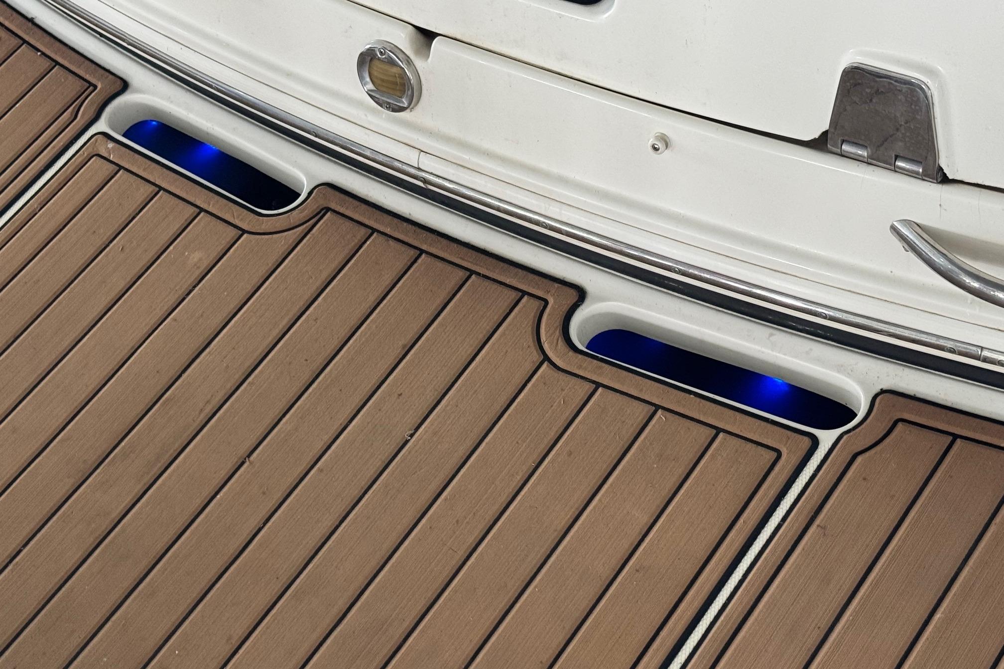 Teak deck with blue LED lights on 2006 Chaparral 330 Signature boat.