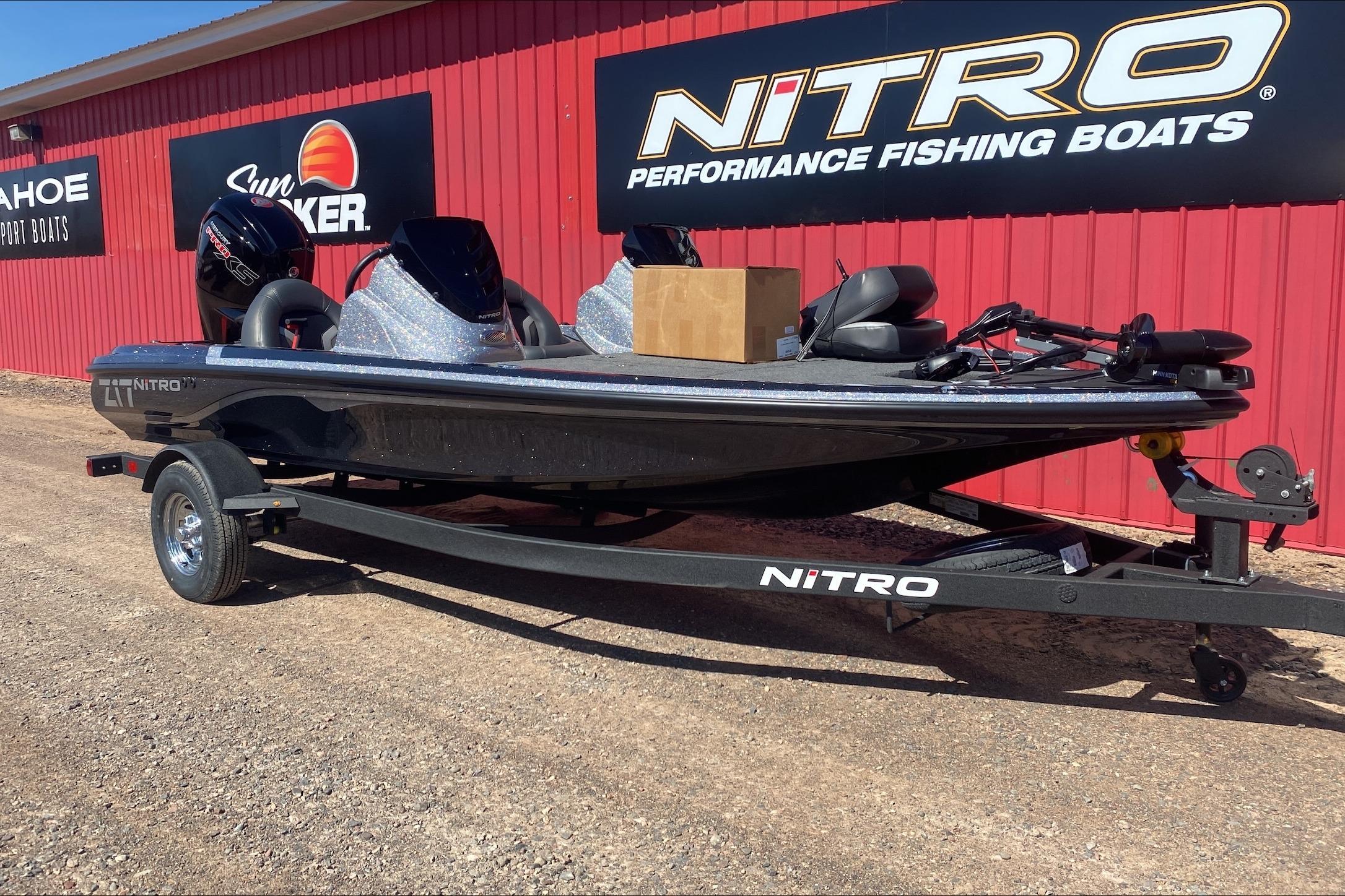 2026 Nitro Z17 fishing boat on trailer, parked outside dealership.
