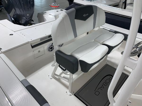 2024 Robalo 246 Cayman boat interior with cushioned seating and storage.