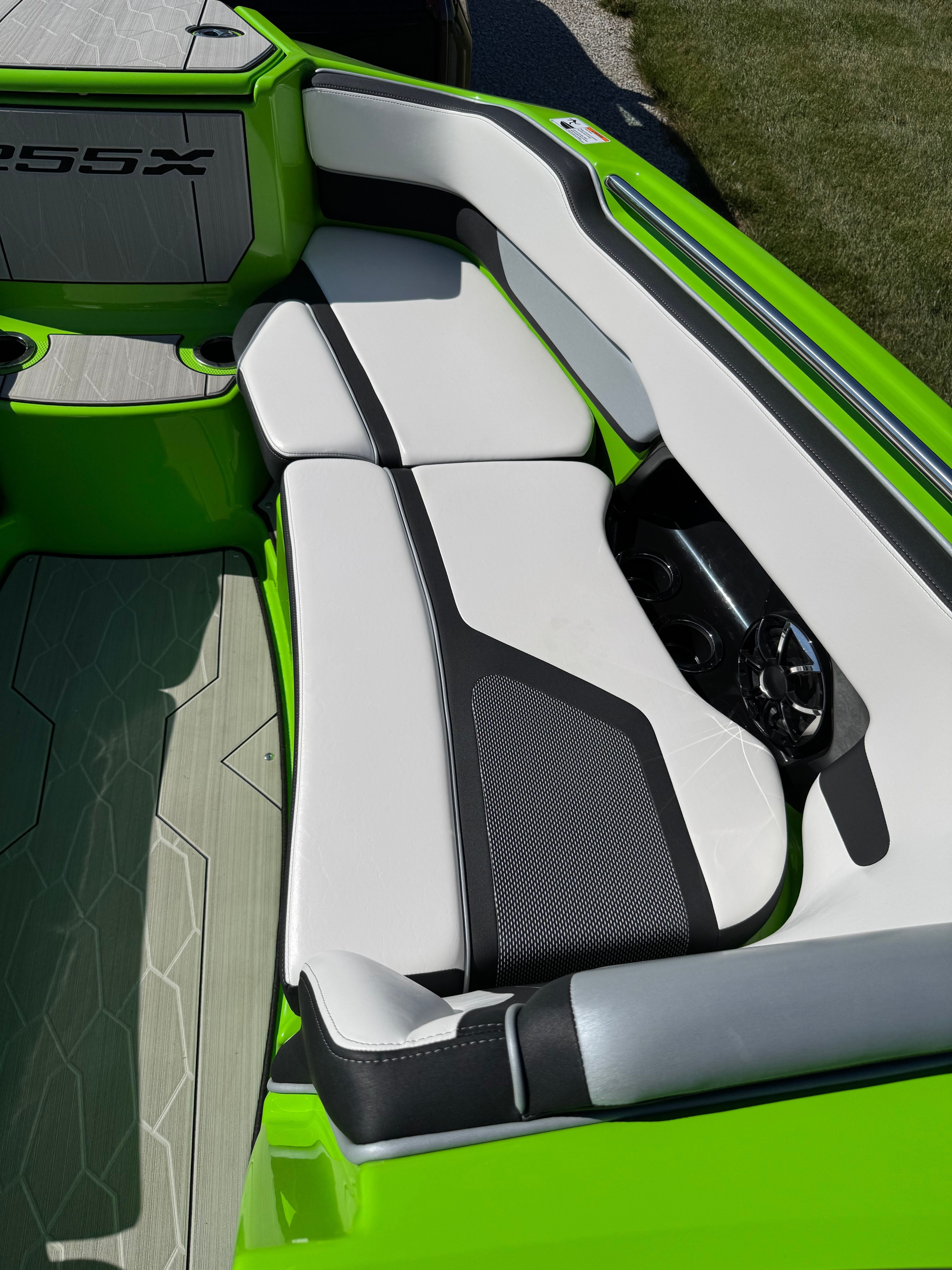 Interior view of a 2022 Yamaha 255XD with white and black upholstery.