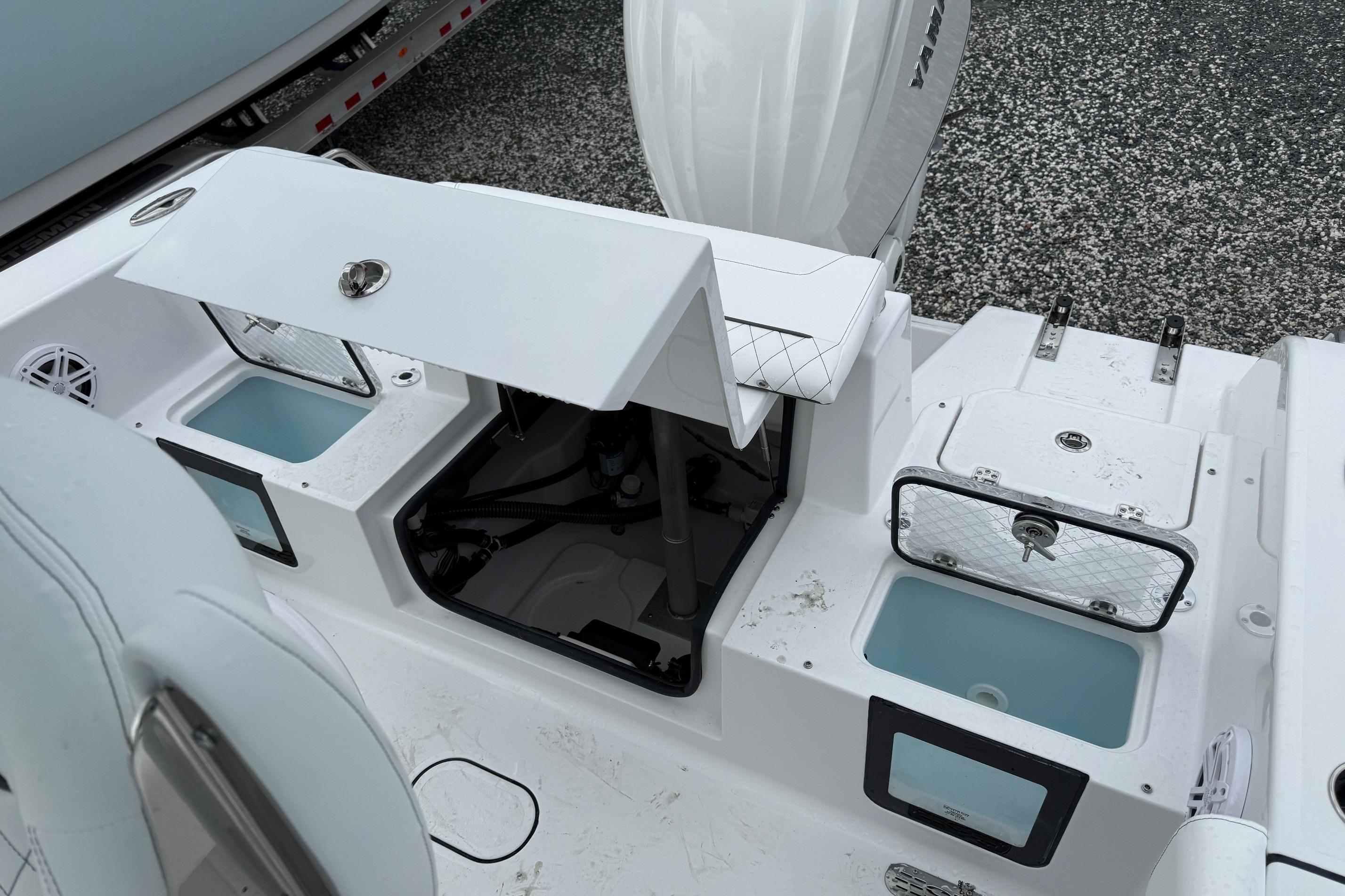 2026 Sportsman Heritage 231 Center Console boat interior with storage compartments and seating.