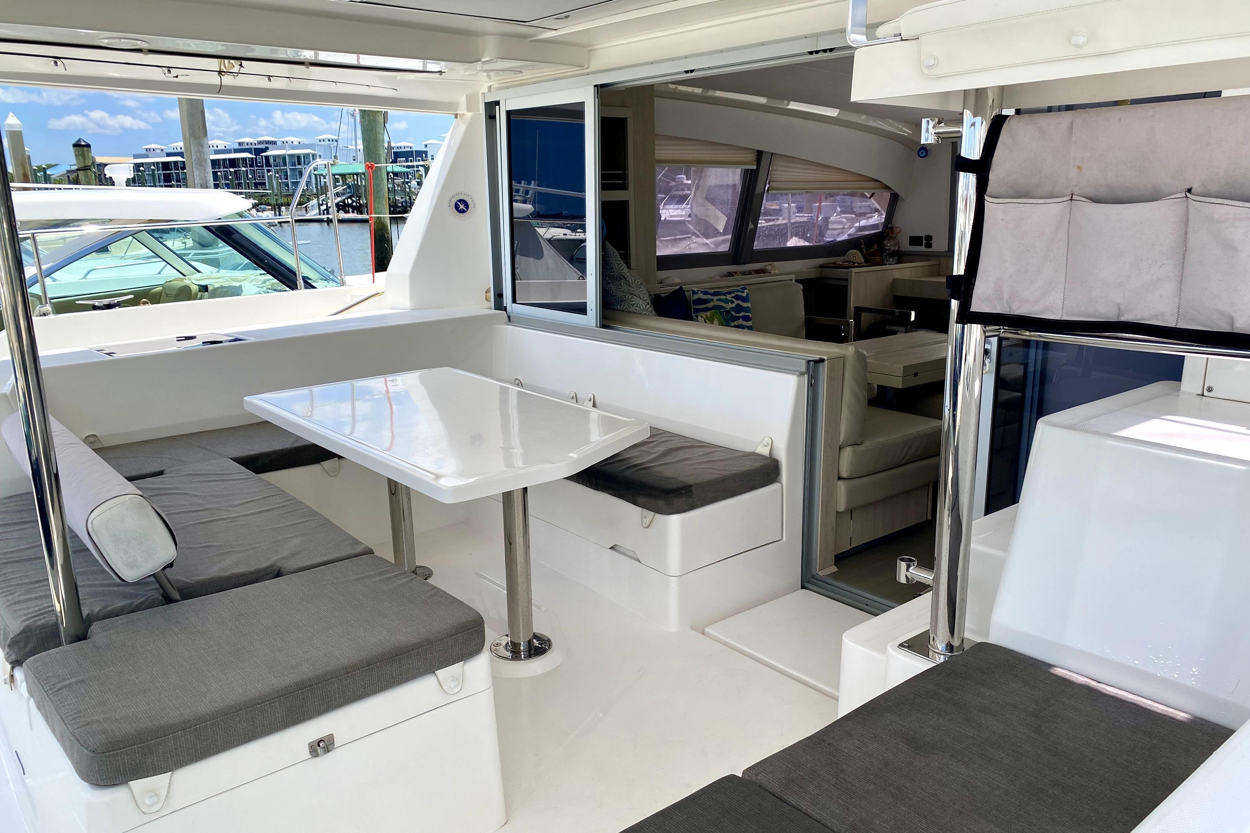 Spacious interior of a 2017 Leopard 40 catamaran with modern seating and dining area.