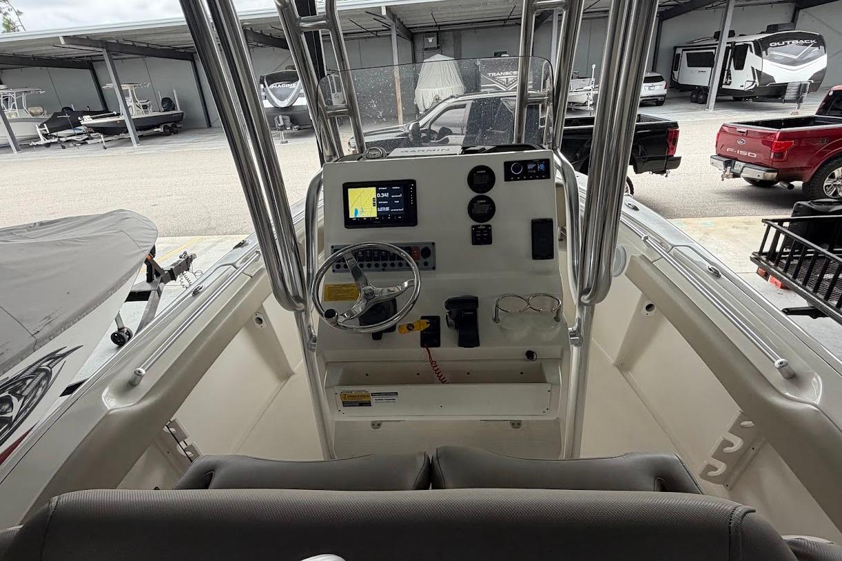2024 Key West 219 FS boat console with steering wheel and navigation display.