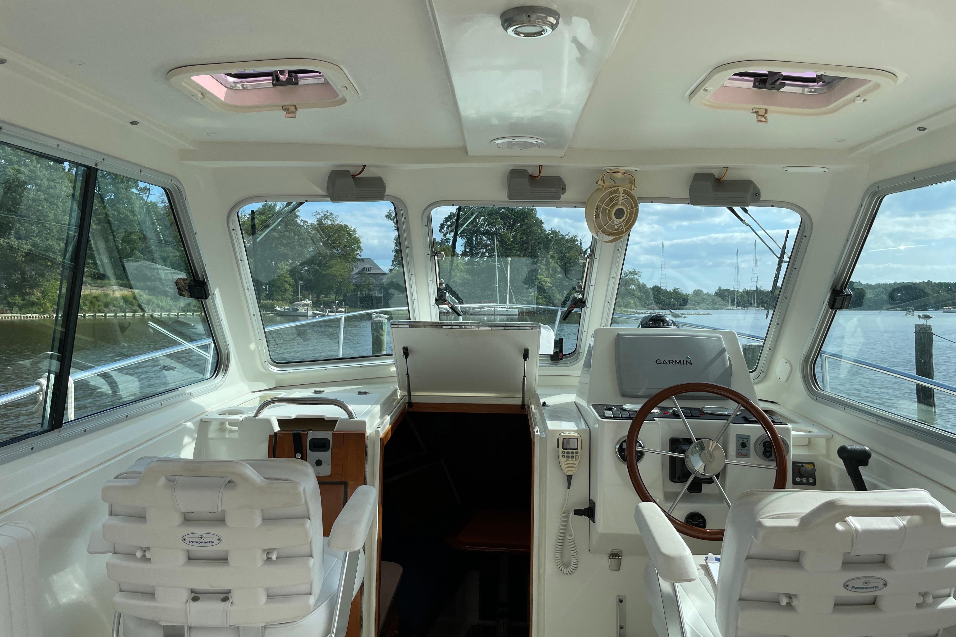 Interior view of 2007 Back Cove 29 boat with steering wheel and navigation system.