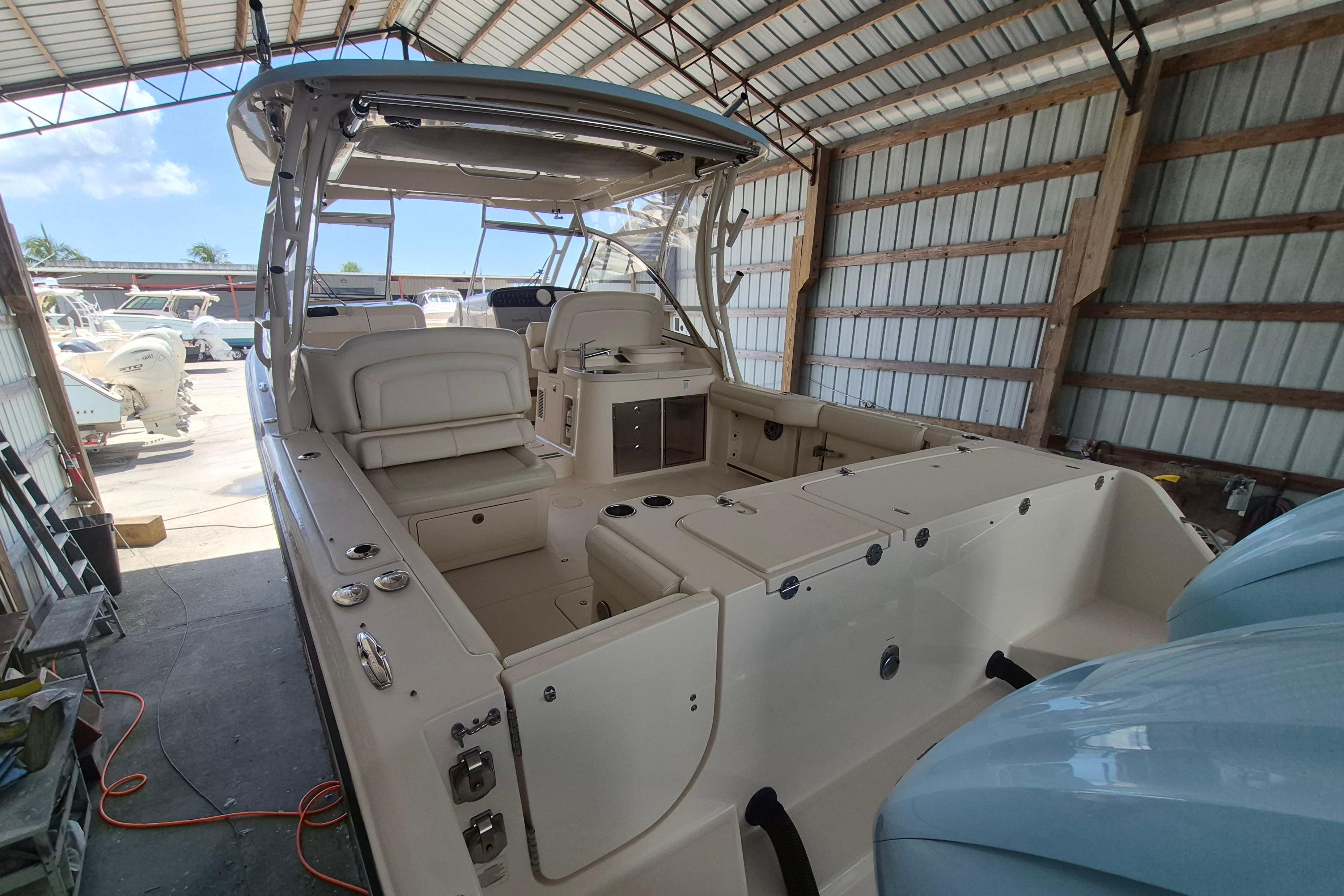 2019 Grady-White Freedom 335 boat in a covered storage area.