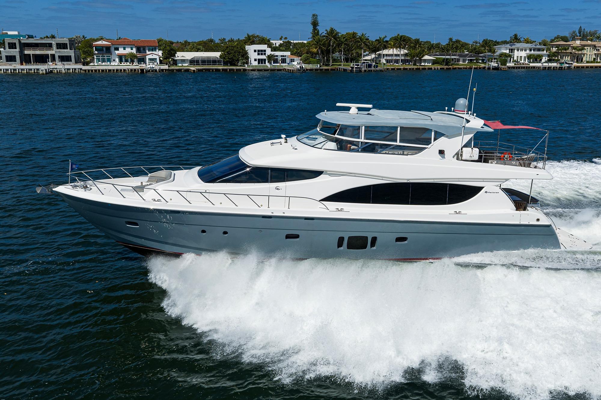 2013 Hatteras 80 Motor Yacht cruising on open water, luxury vessel in motion.