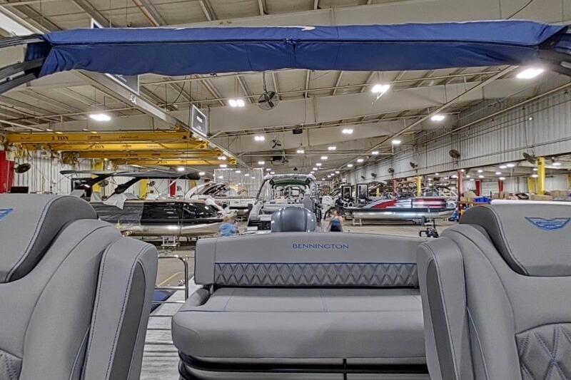 2026 Bennington 23 LXS Swingback boat interior in a manufacturing facility.