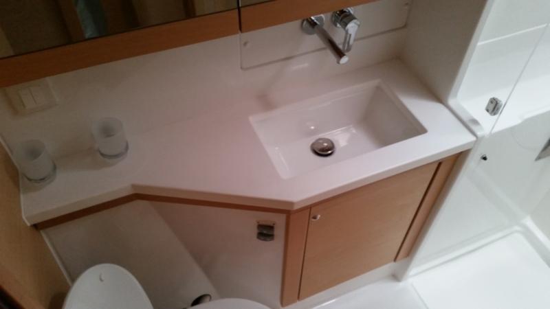 Modern bathroom interior of 2017 Lagoon 450S yacht, featuring sleek sink and cabinetry.