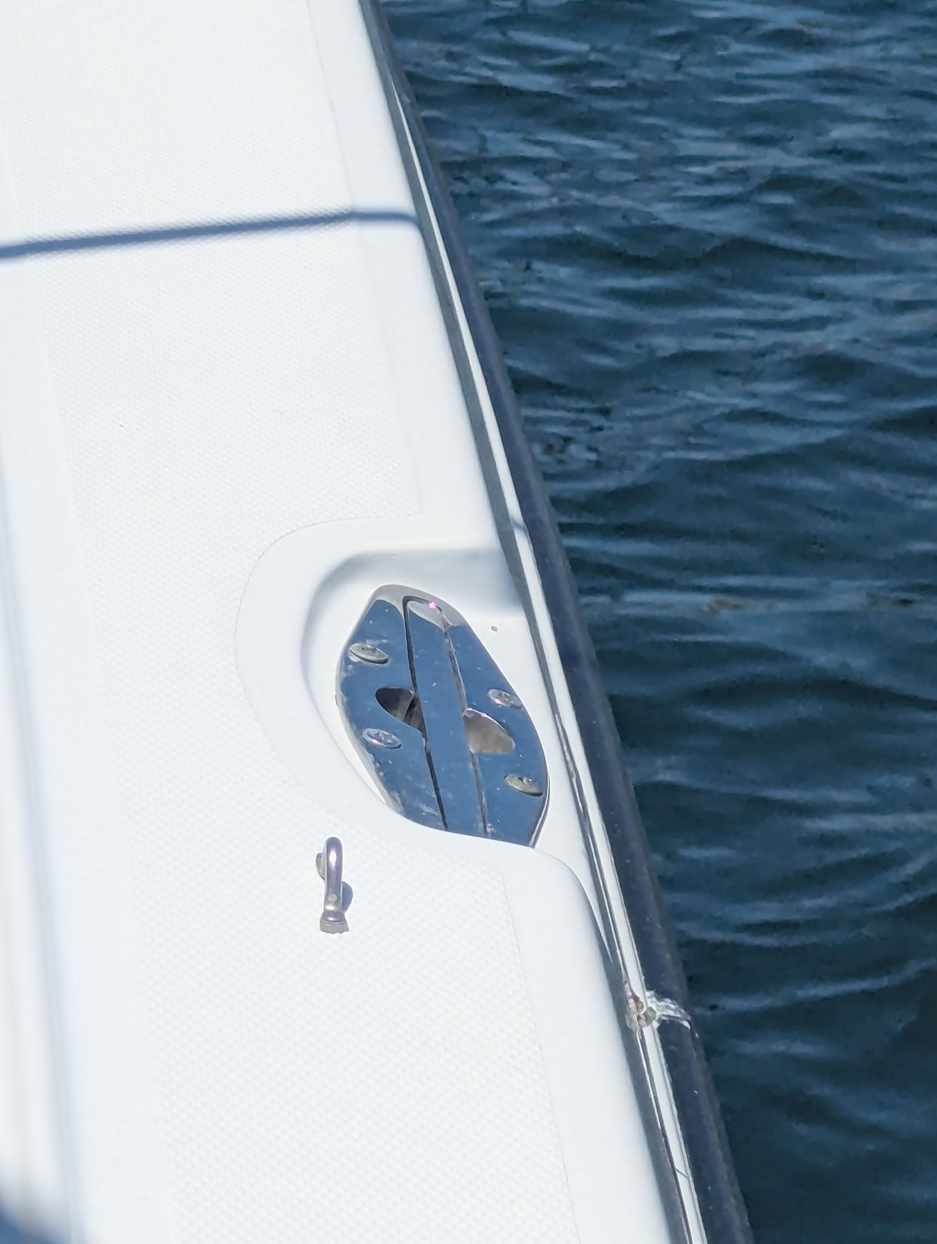 Close-up of a 2005 Wellcraft 35 CCF boat deck by the water.