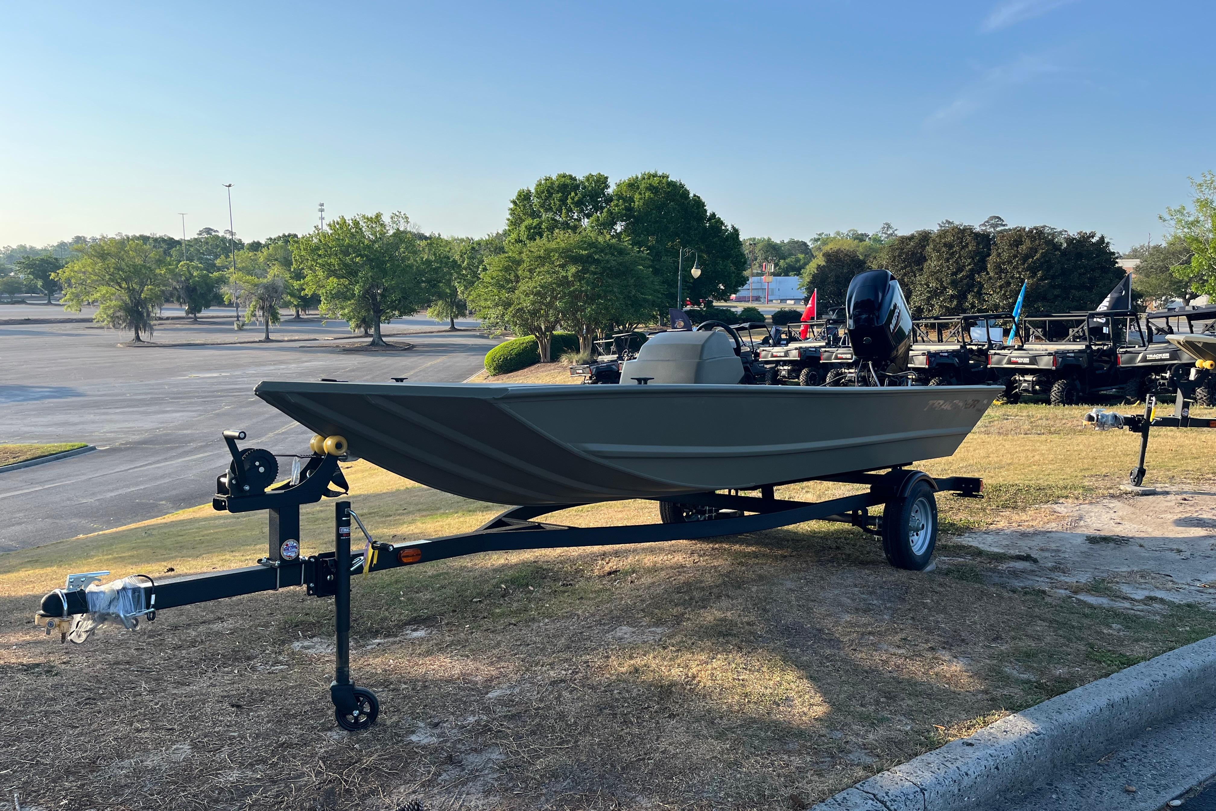 2026 Tracker Grizzly 1648 SC boat on trailer in outdoor setting.