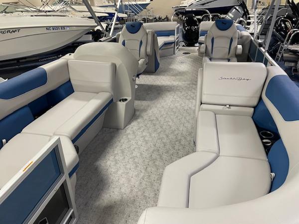 2025 South Bay LE pontoon boat interior with blue and white seating.