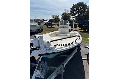 2025 Mako 18 LTS boat on trailer, parked outdoors under clear sky.
