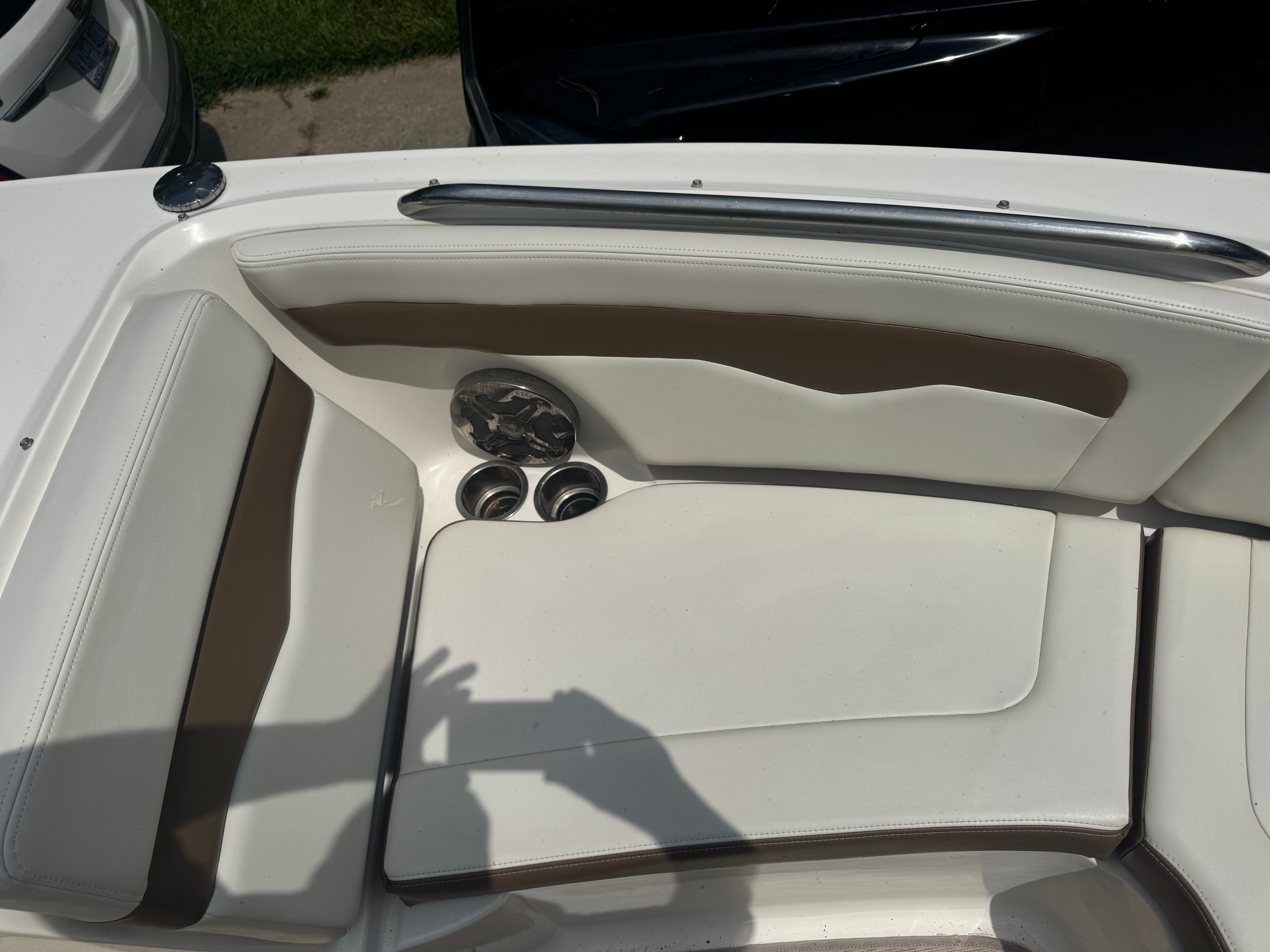 Interior of a 2016 Chaparral 246 SSi boat with white seating.